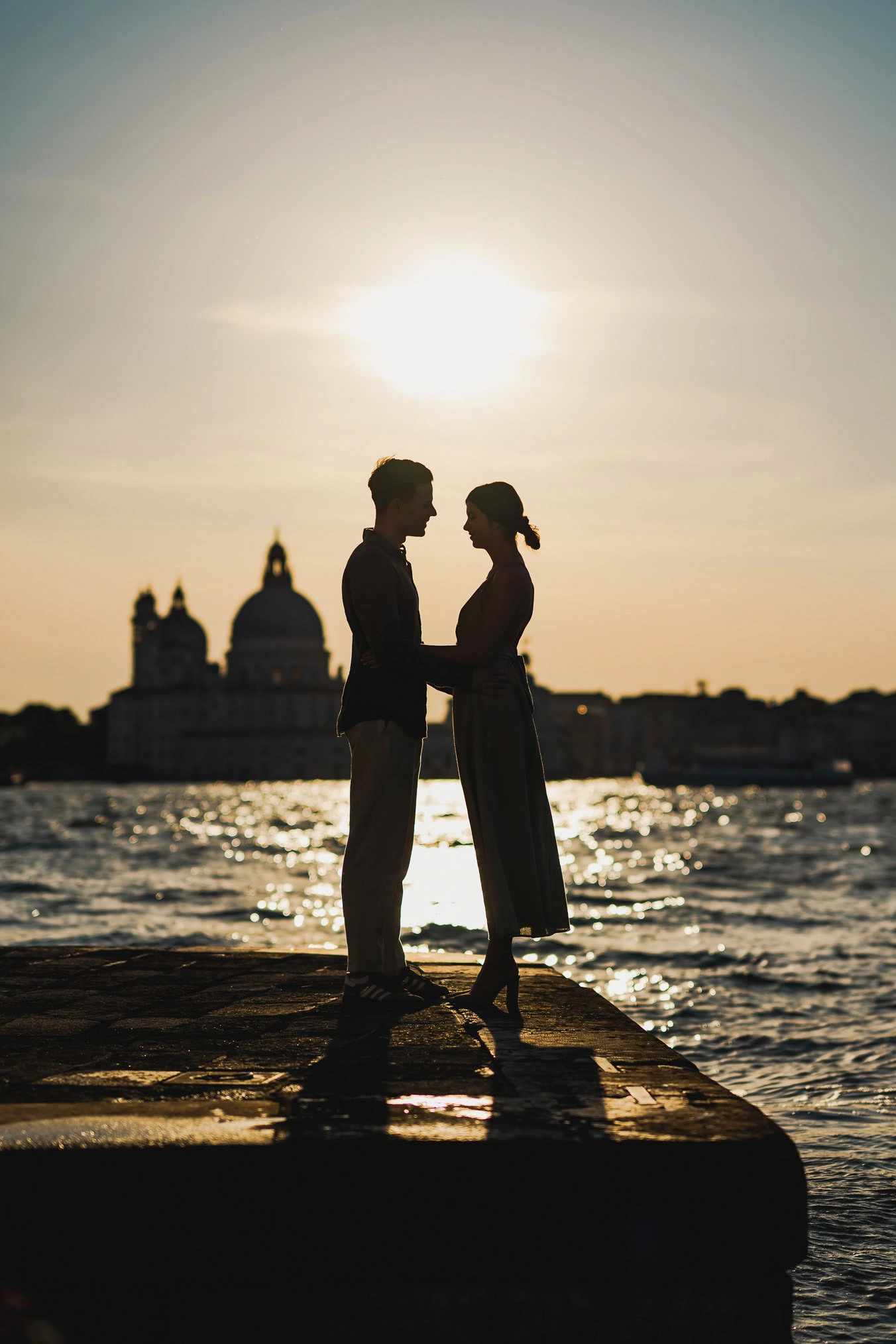 Man proposing to his girlfriend at sunset on San Giorgio Maggiore island