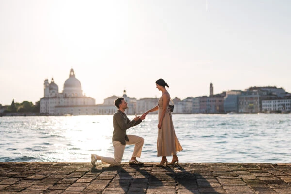 Man proposing to his girlfriend at sunset on San Giorgio Maggiore island