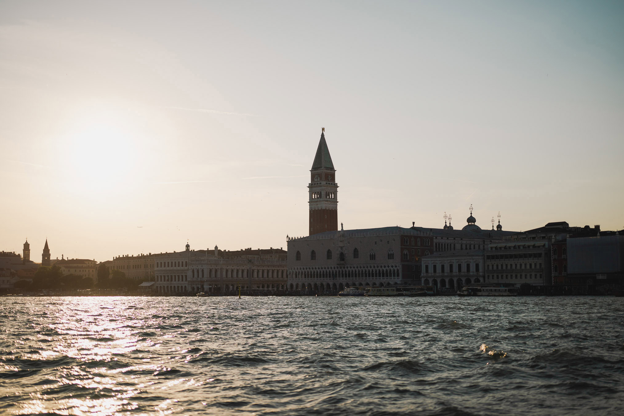 Engaged couple walking hand in hand through San Marco district