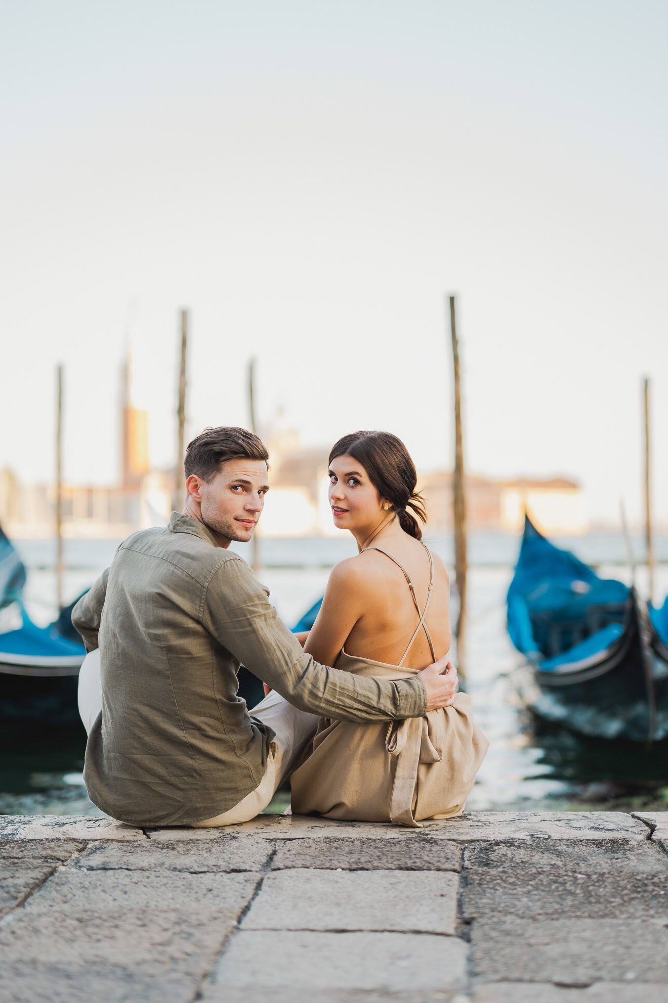 Engaged couple walking hand in hand through San Marco district