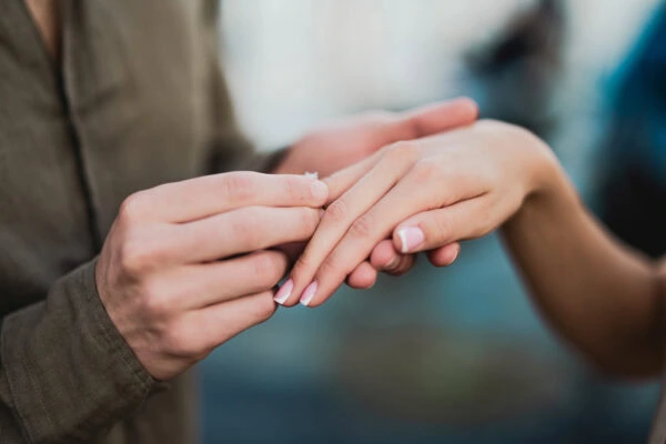 Engaged couple walking hand in hand through San Marco district
