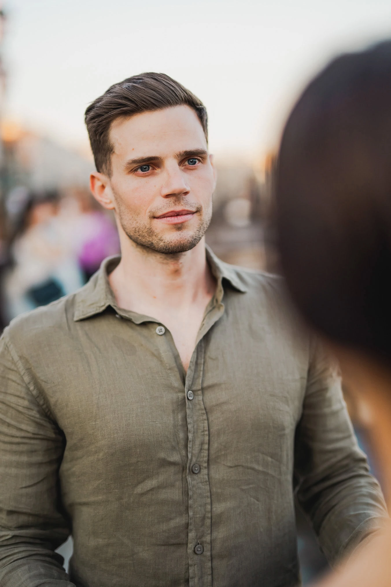 Engaged couple walking hand in hand through San Marco district