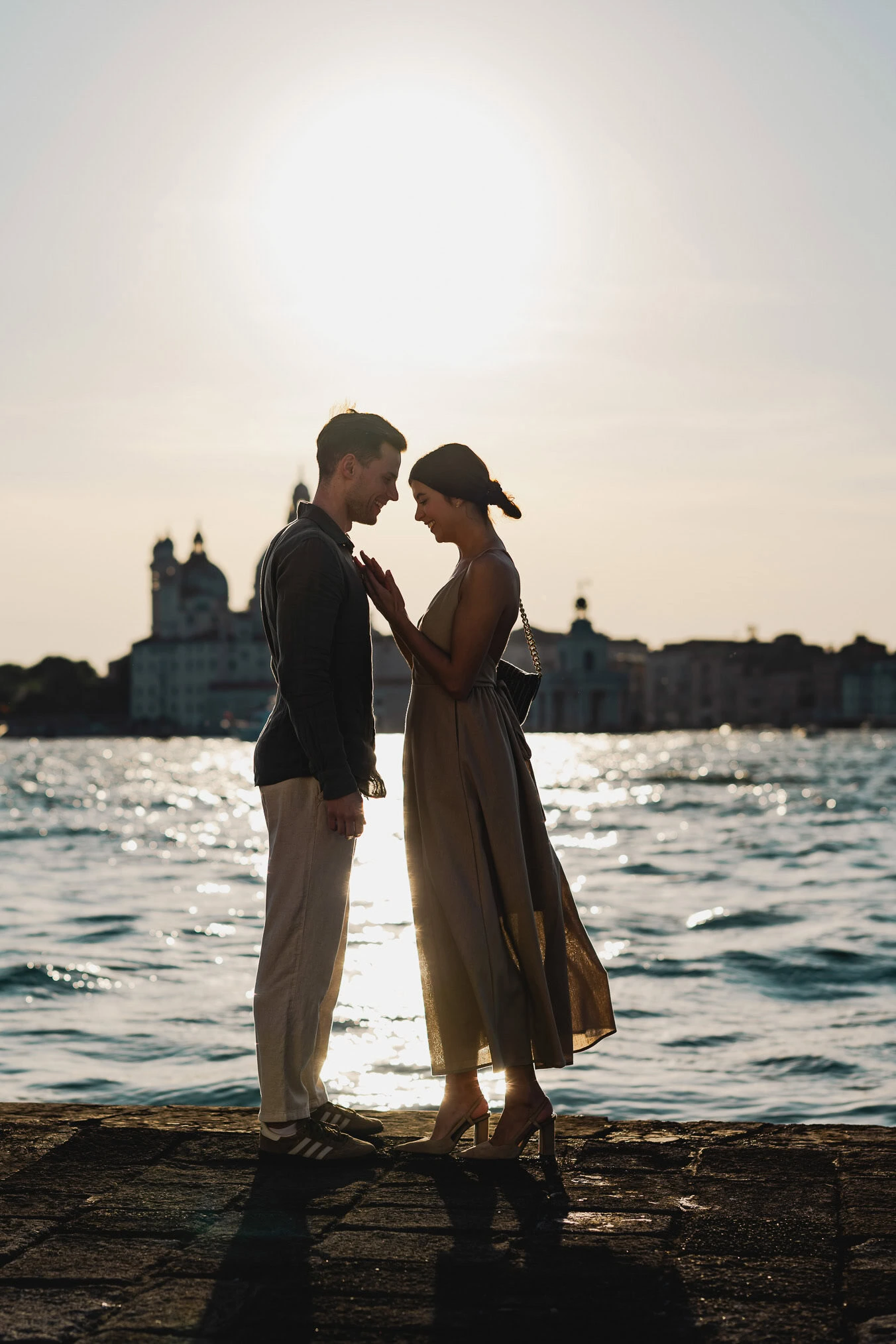 Man proposing to his girlfriend at sunset on San Giorgio Maggiore island