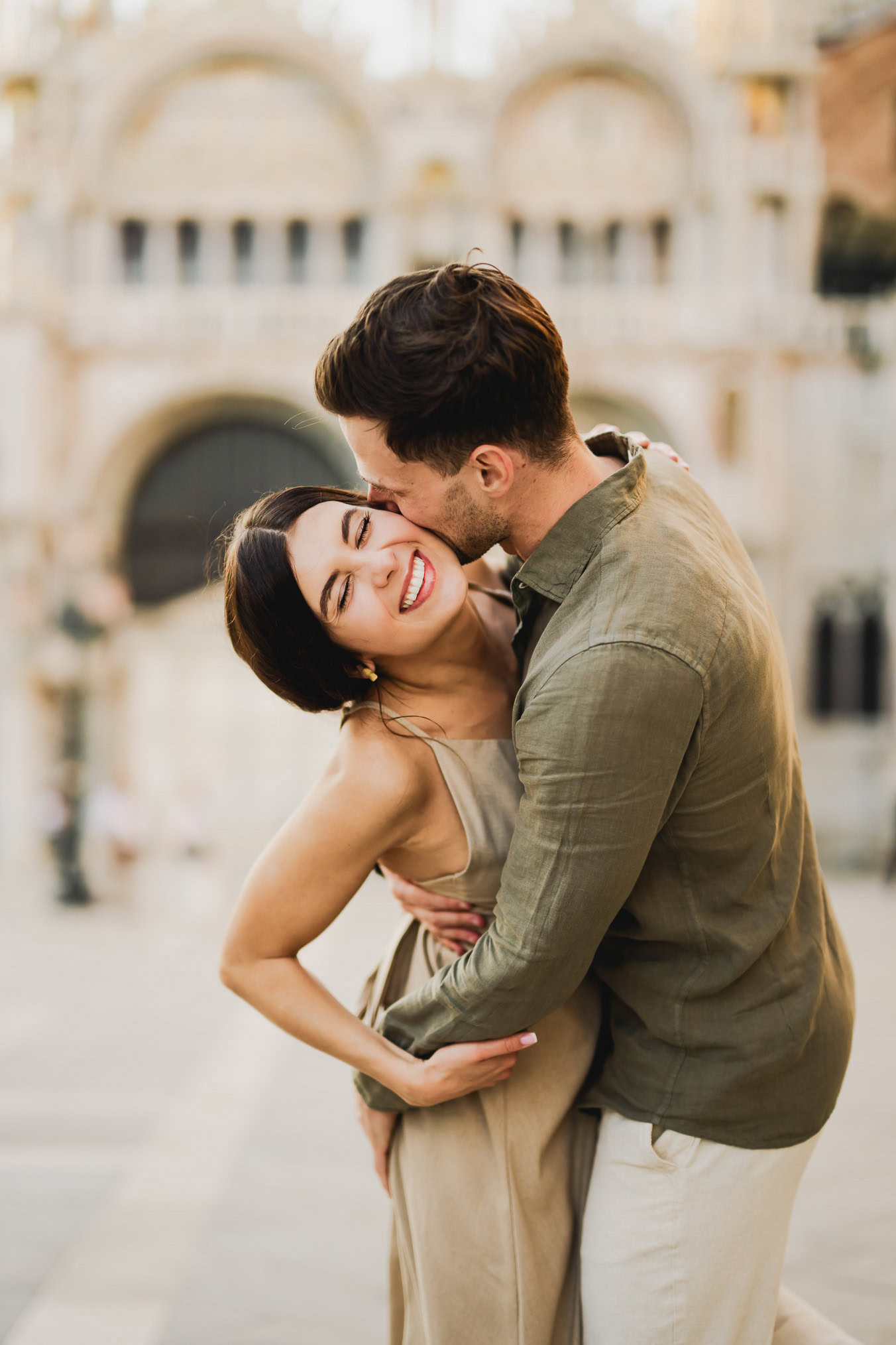 Engaged couple walking hand in hand through San Marco district
