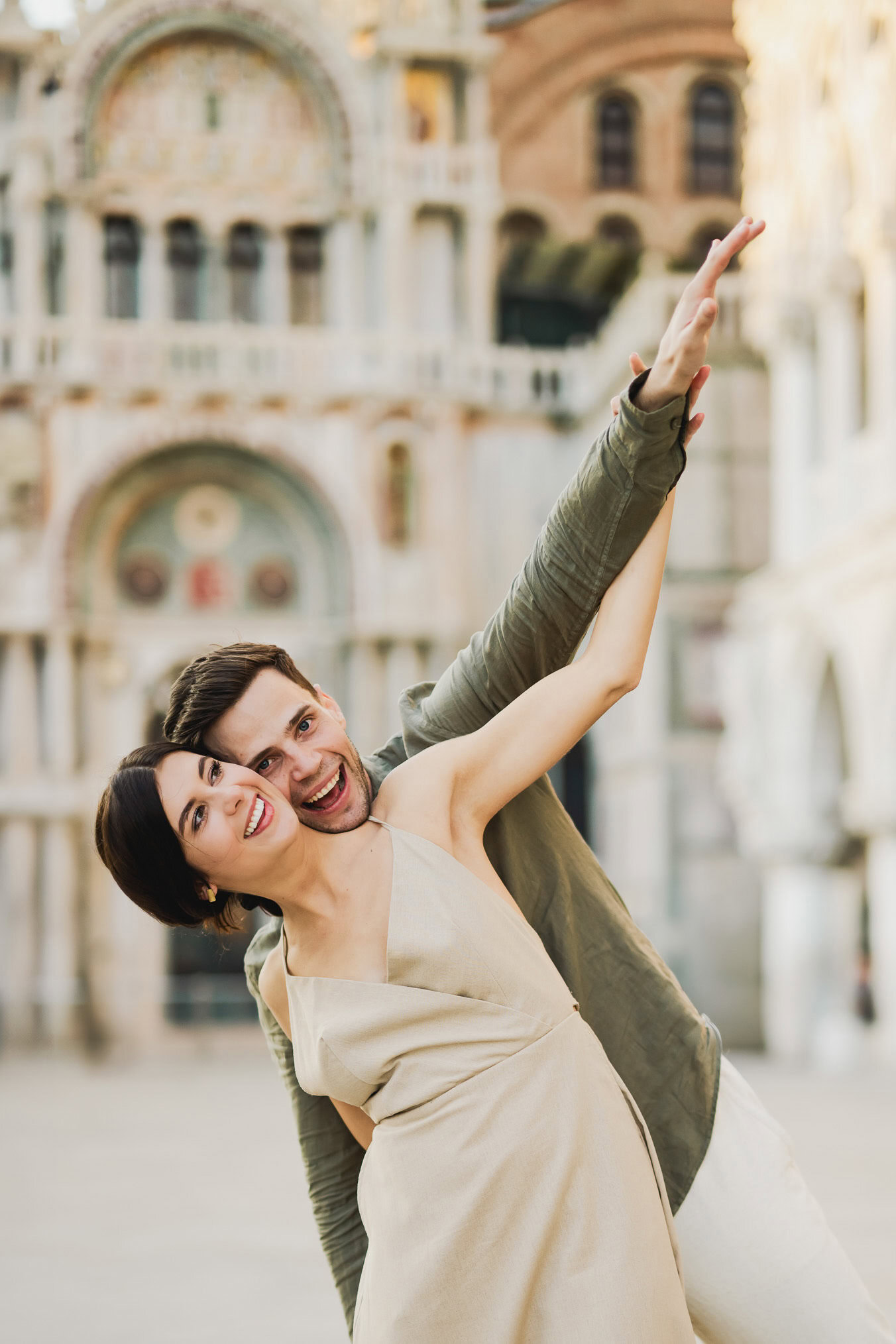 Engaged couple walking hand in hand through San Marco district