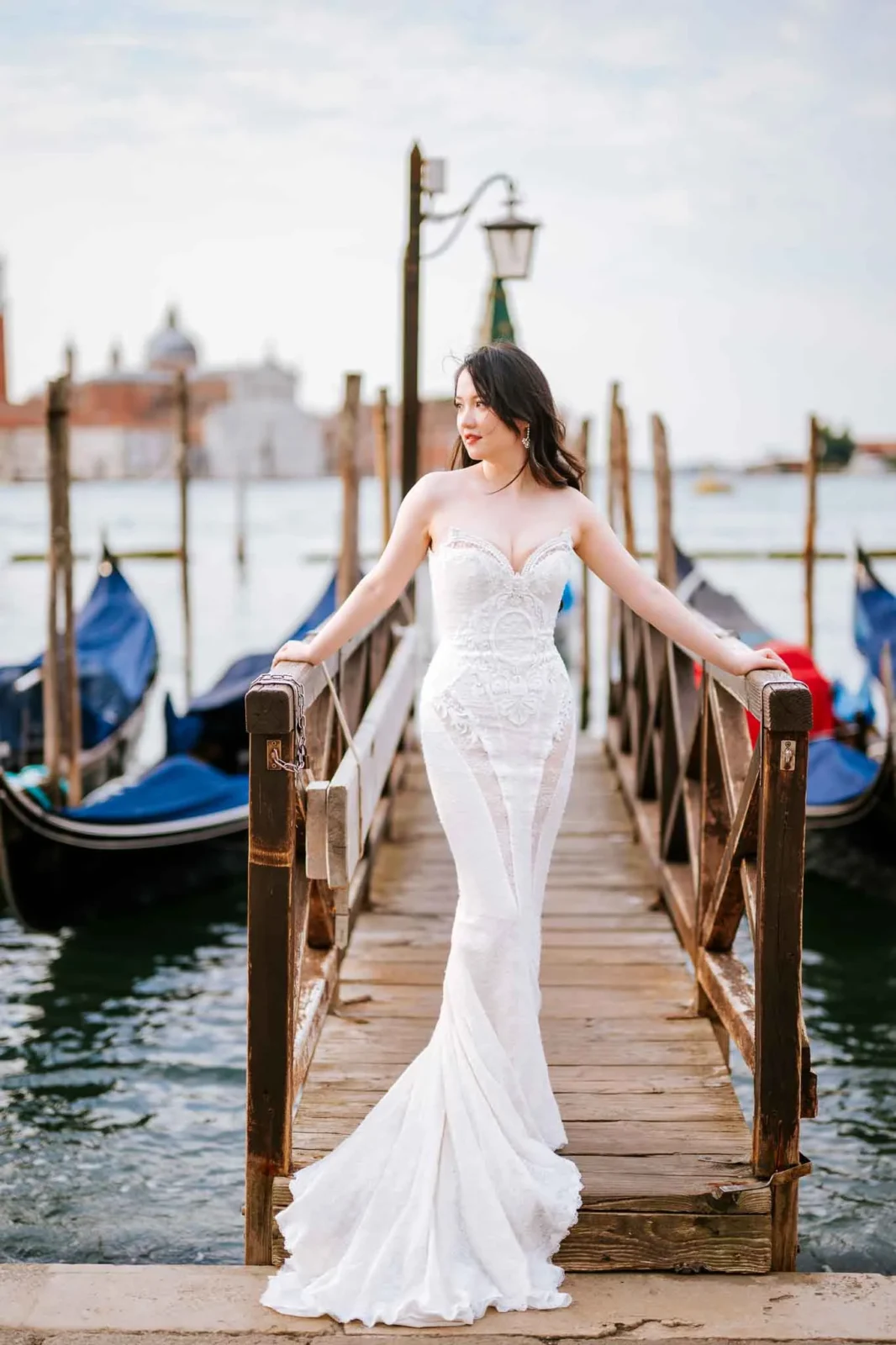 Gondola pier with a bride in a wedding dress by Venice canals, romantic proposal photography.