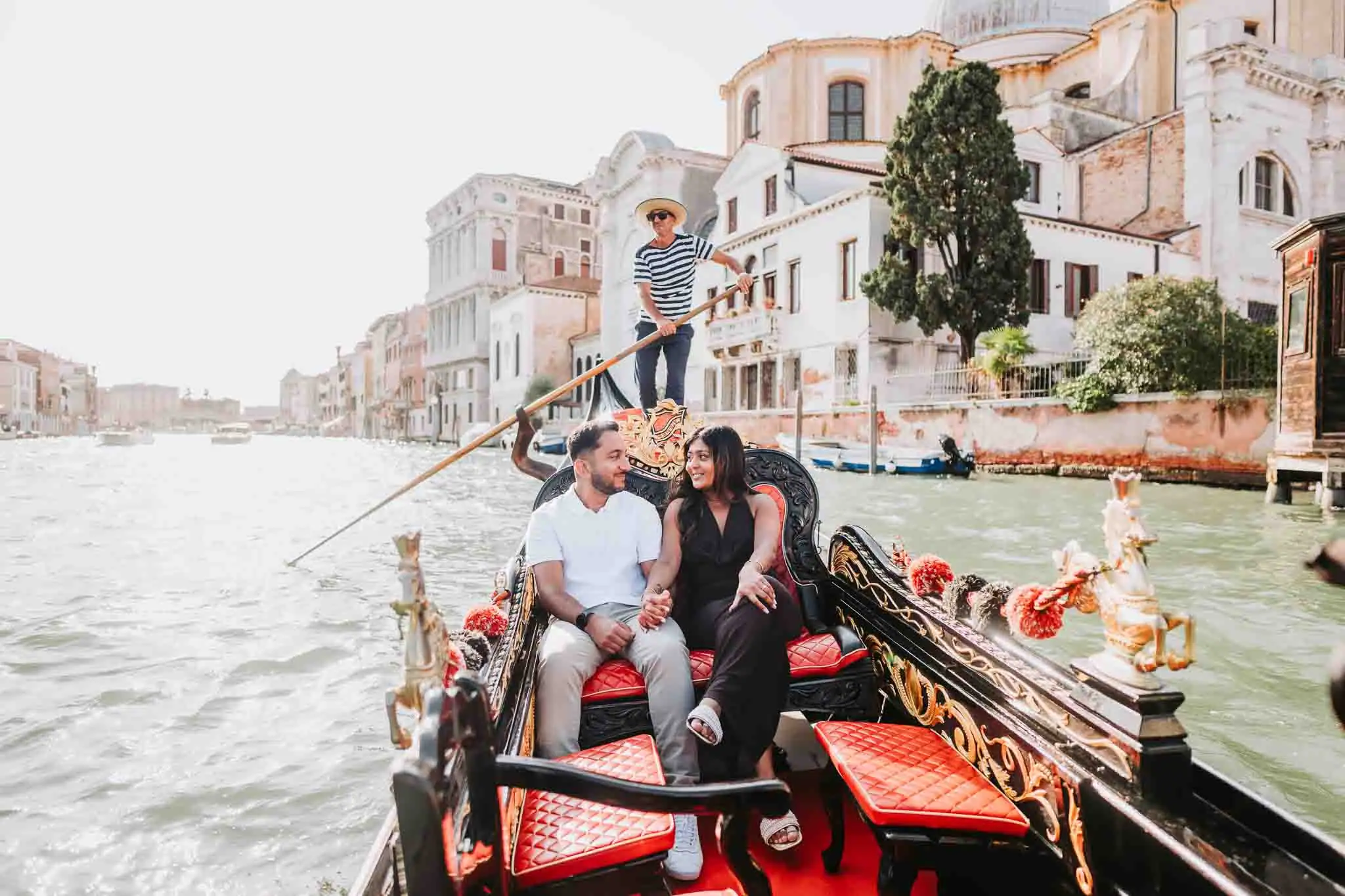 Couple enjoying a romantic gondola ride.