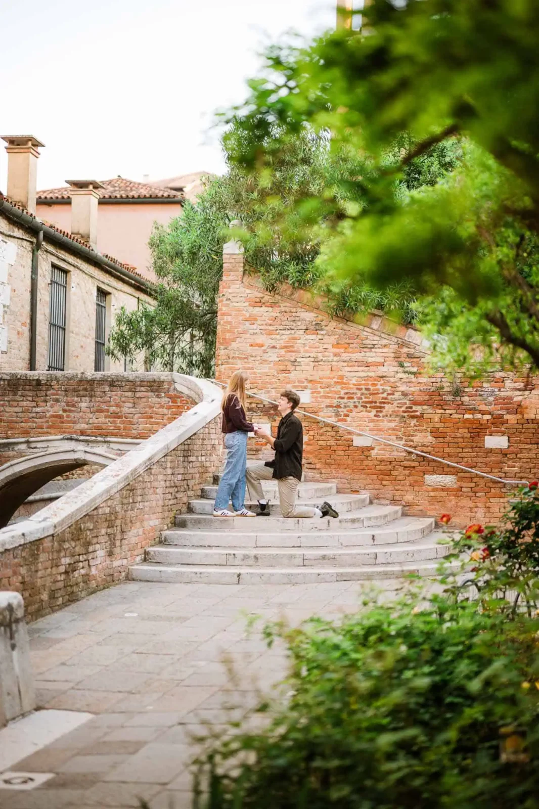 Couple on romantic staircase in Venice.
