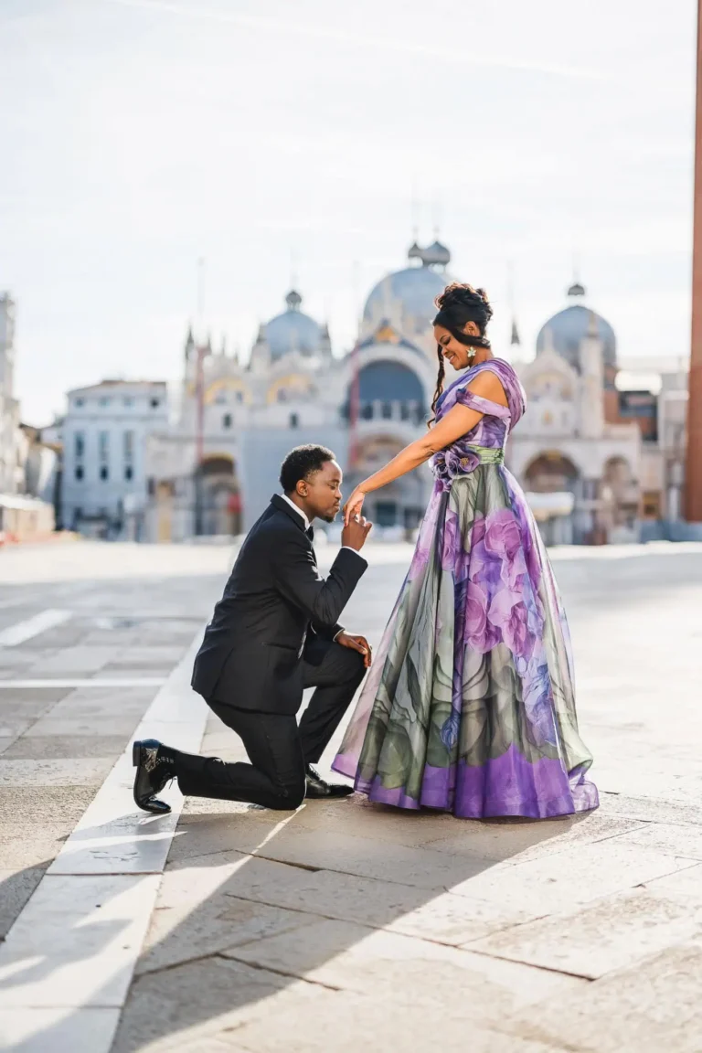 Elegant couple in romantic proposal portrait overlooking Venice architecture, capturing love and timeless moments.