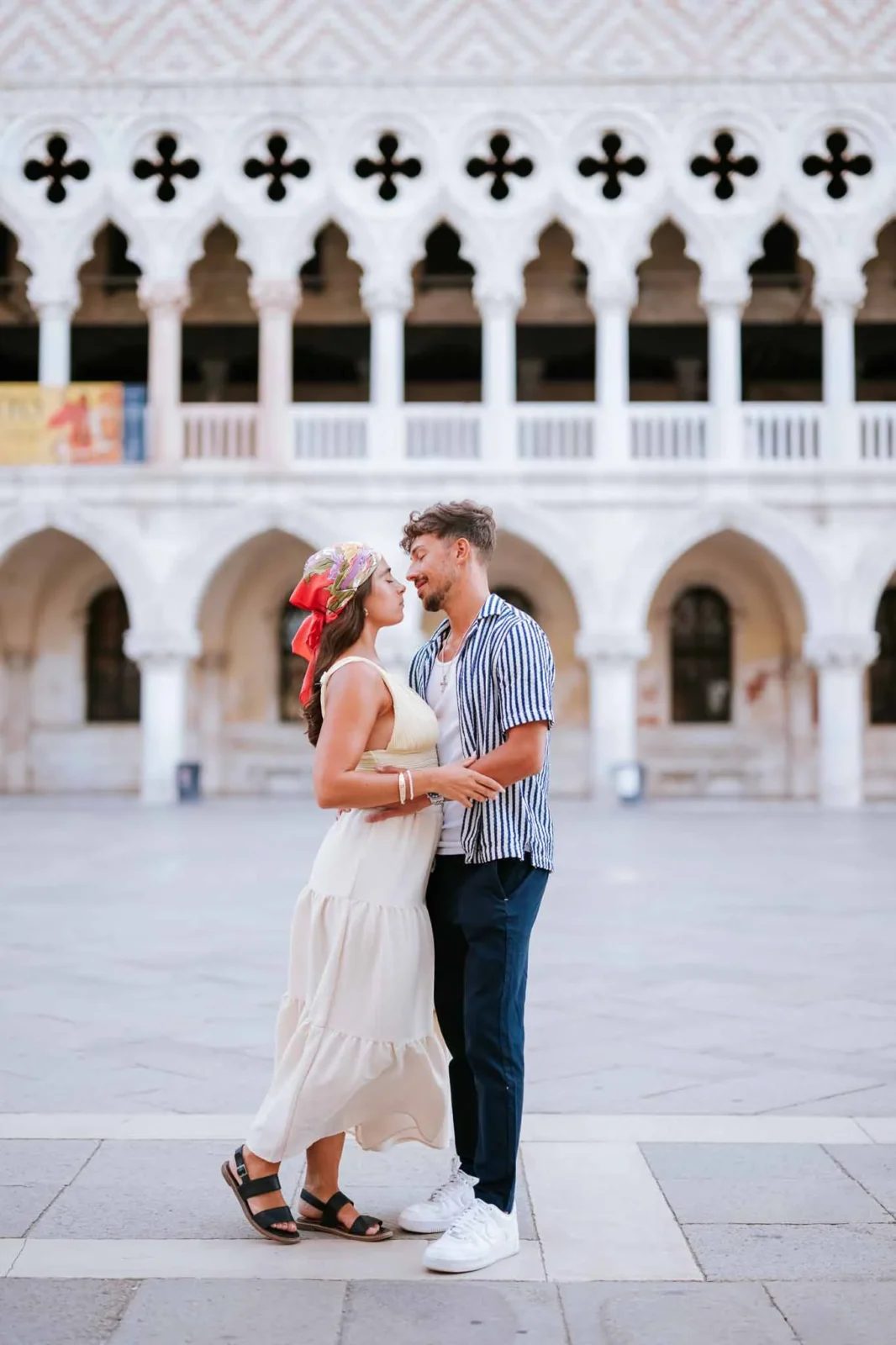 1. Romantic couple in Venice, Italy, during sunset, ready for wedding proposal photoshoot.