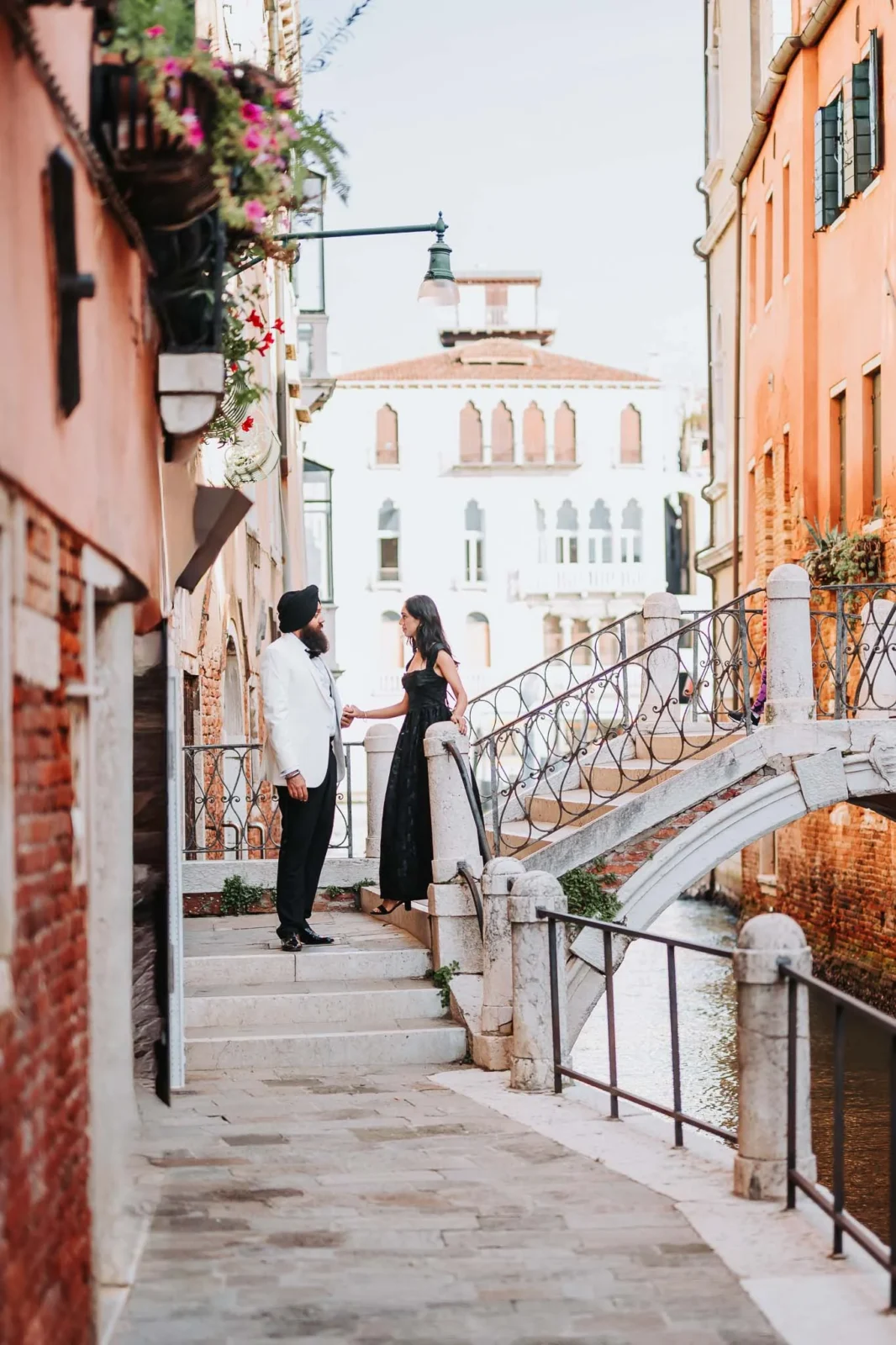 1. Romantic couple in Venice, Italy, during sunset by a canal, celebrating an engagement.