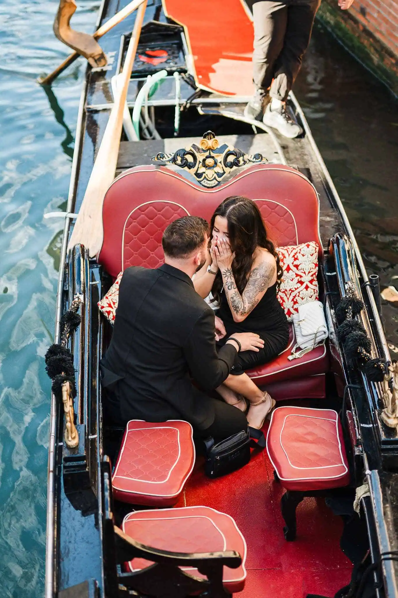 A romantic moment in a gondola on Venice canals, capturing love and engagement photography.