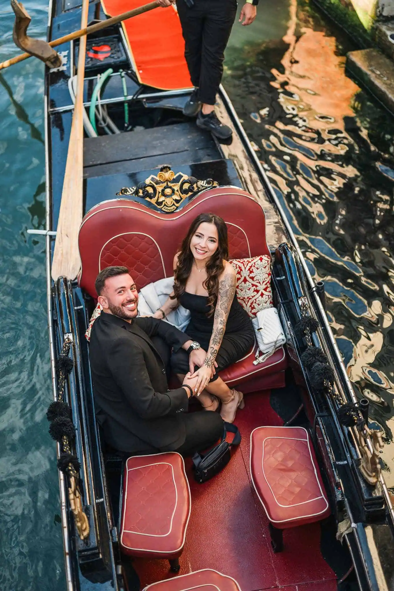 Elegant couple in a gondola, Venice, romantic engagement photoshoot, Venice wedding proposal, Venice engagement photographer.