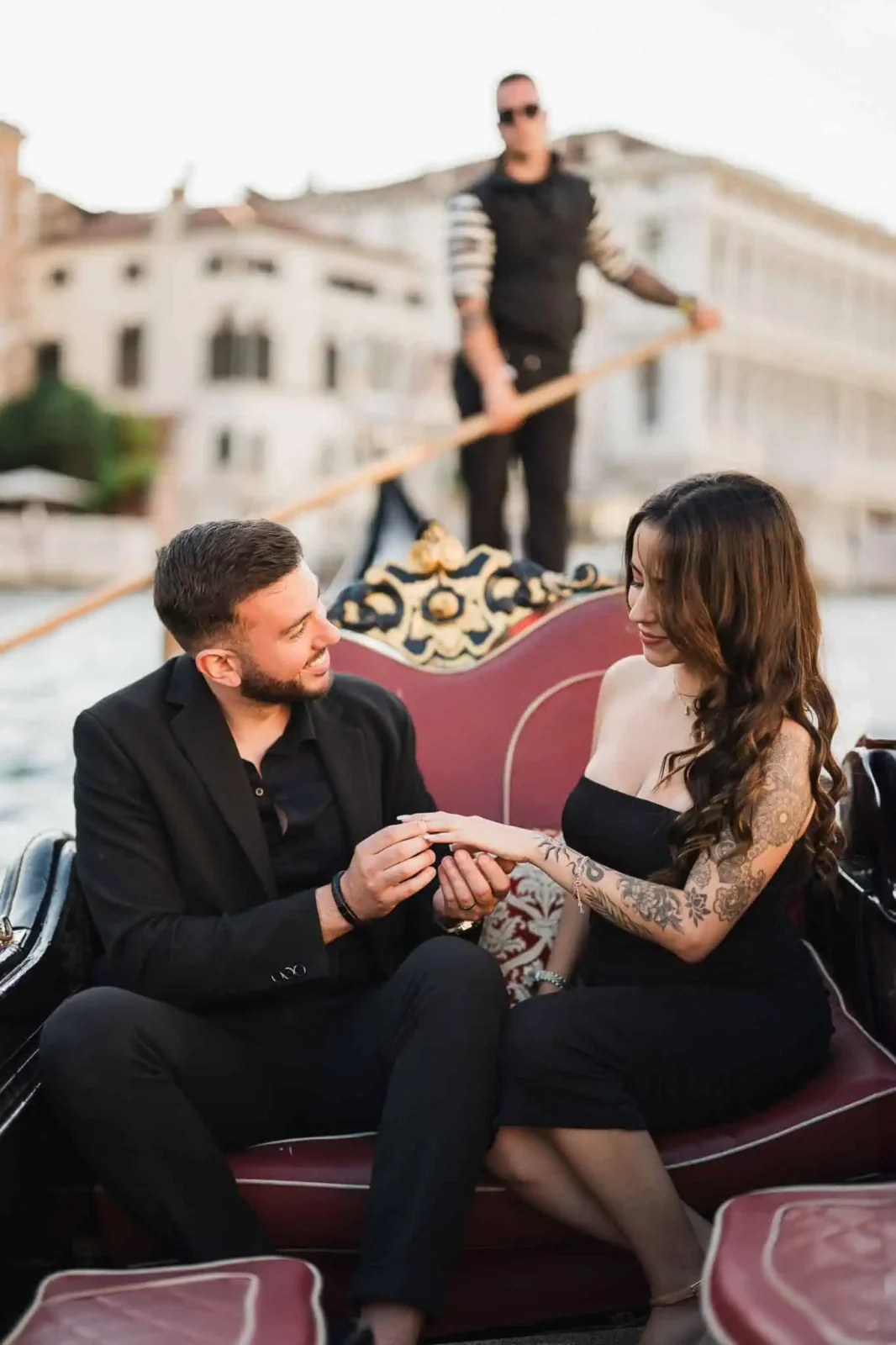Romantic couple during a gondola proposal in Venice, captured by a professional wedding and engagement photographer.
