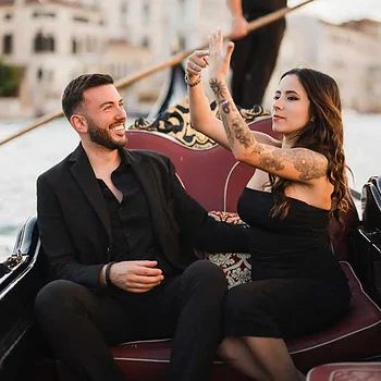 A romantic gondola ride in Venice with a happy couple celebrating their engagement.