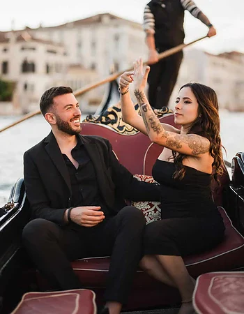 A romantic gondola ride in Venice with a happy couple celebrating their engagement.