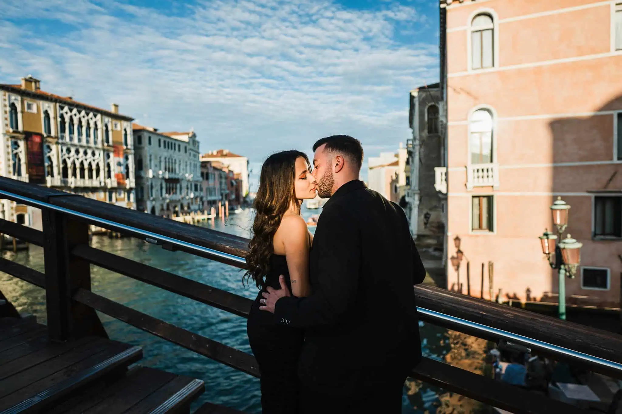 Romantic Venice couple portrait on a bridge during sunset, ideal for wedding and engagement photography.