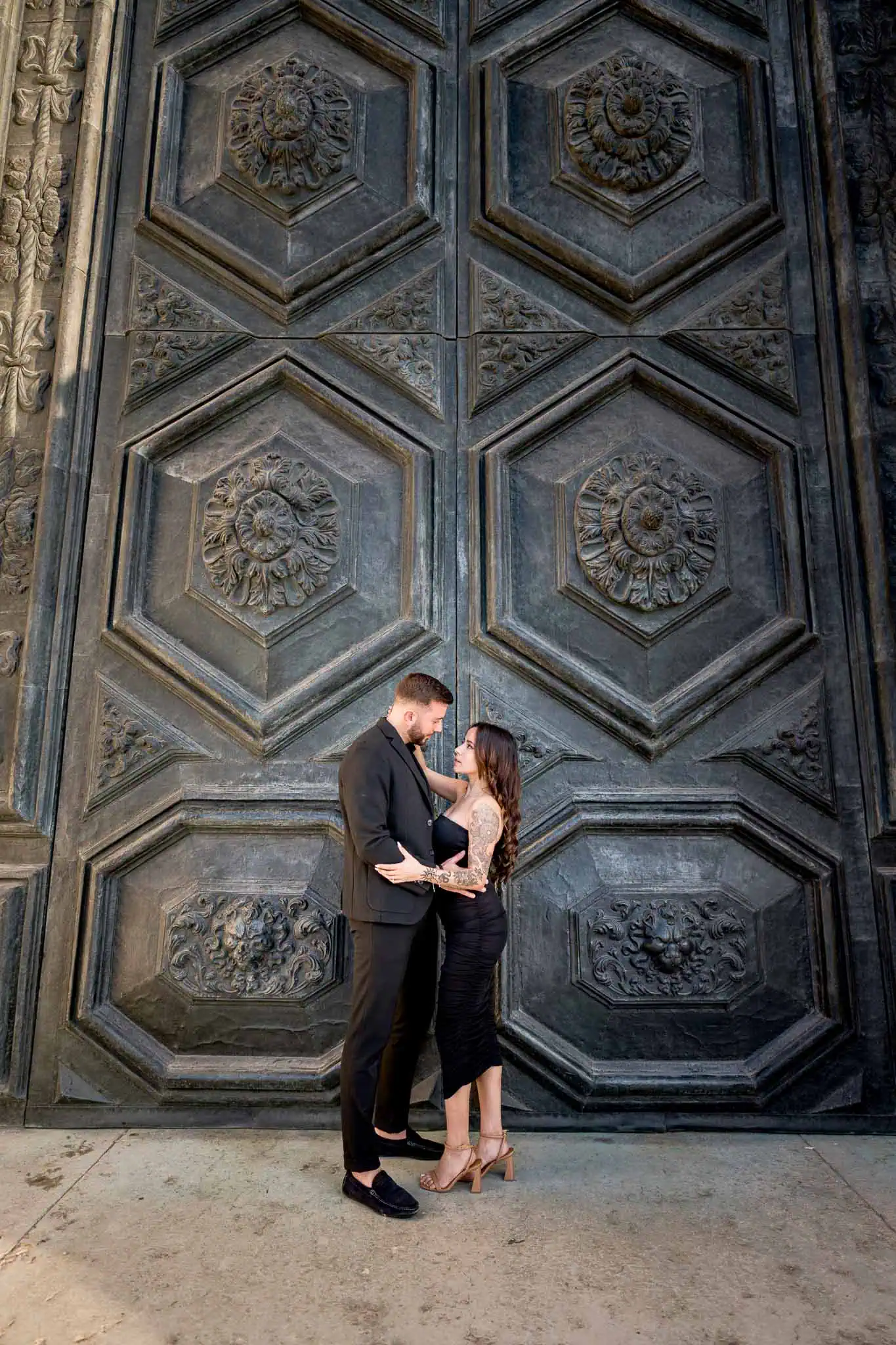 Elegant couple romantic portrait at Venice historic door, wedding proposal.
