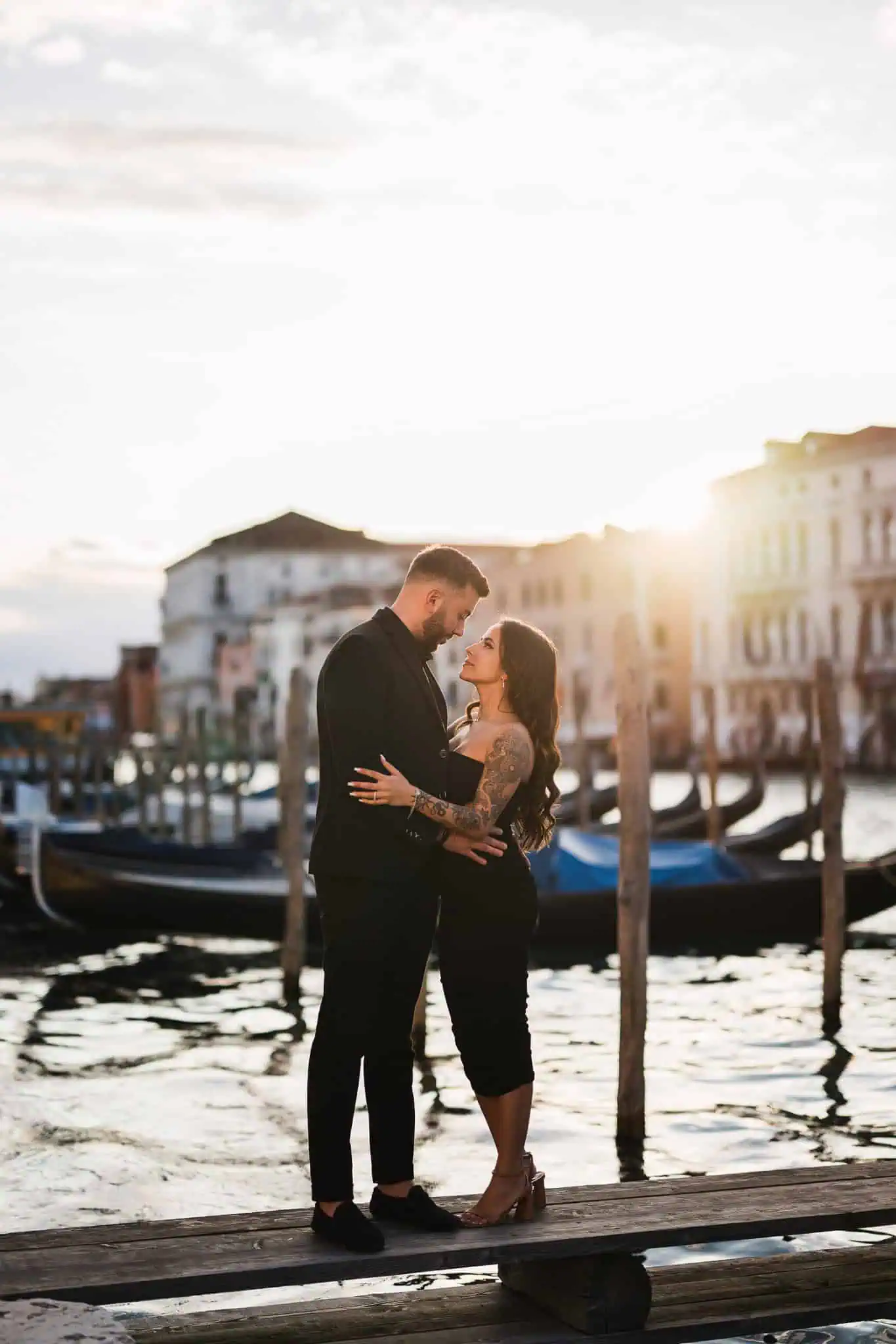 Romantic couple sunset engagement photoshoot in Venice canals, capturing love and heritage.