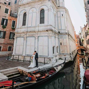 1. Romantic Venice wedding couple by historic church with gondola, Italy, proposal, engagement photography.