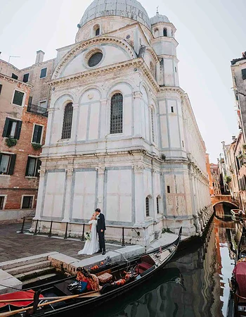 1. Romantic Venice wedding couple by historic church with gondola, Italy, proposal, engagement photography.