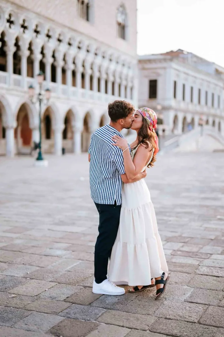 Romantic Venice couple kissing, proposal photography, beautiful historic city background.