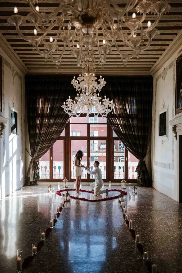 Elegant Venice wedding proposal scene with a romantic candlelit pathway indoors.