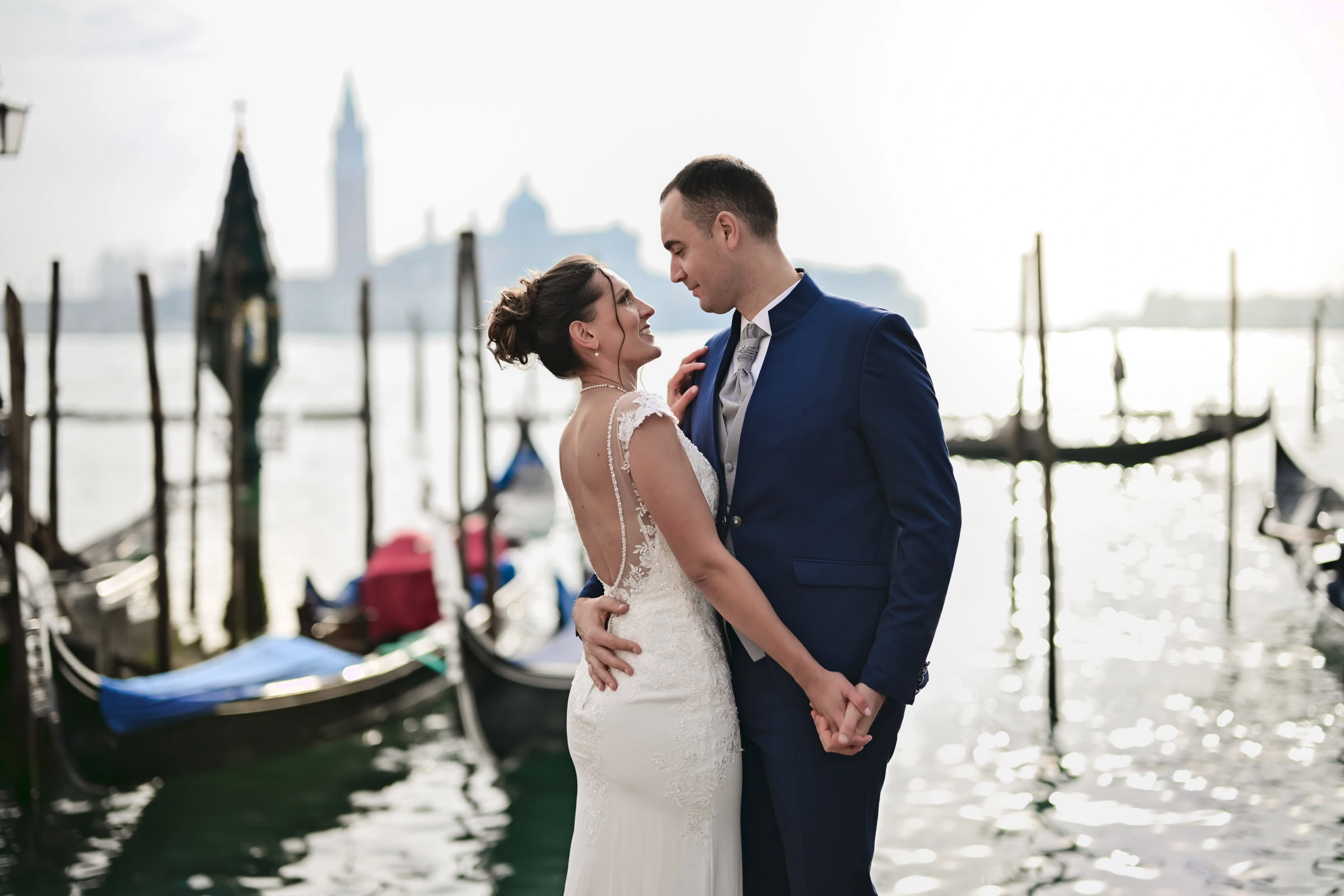 intimate elopement photography in Venice near wooden mooring poles