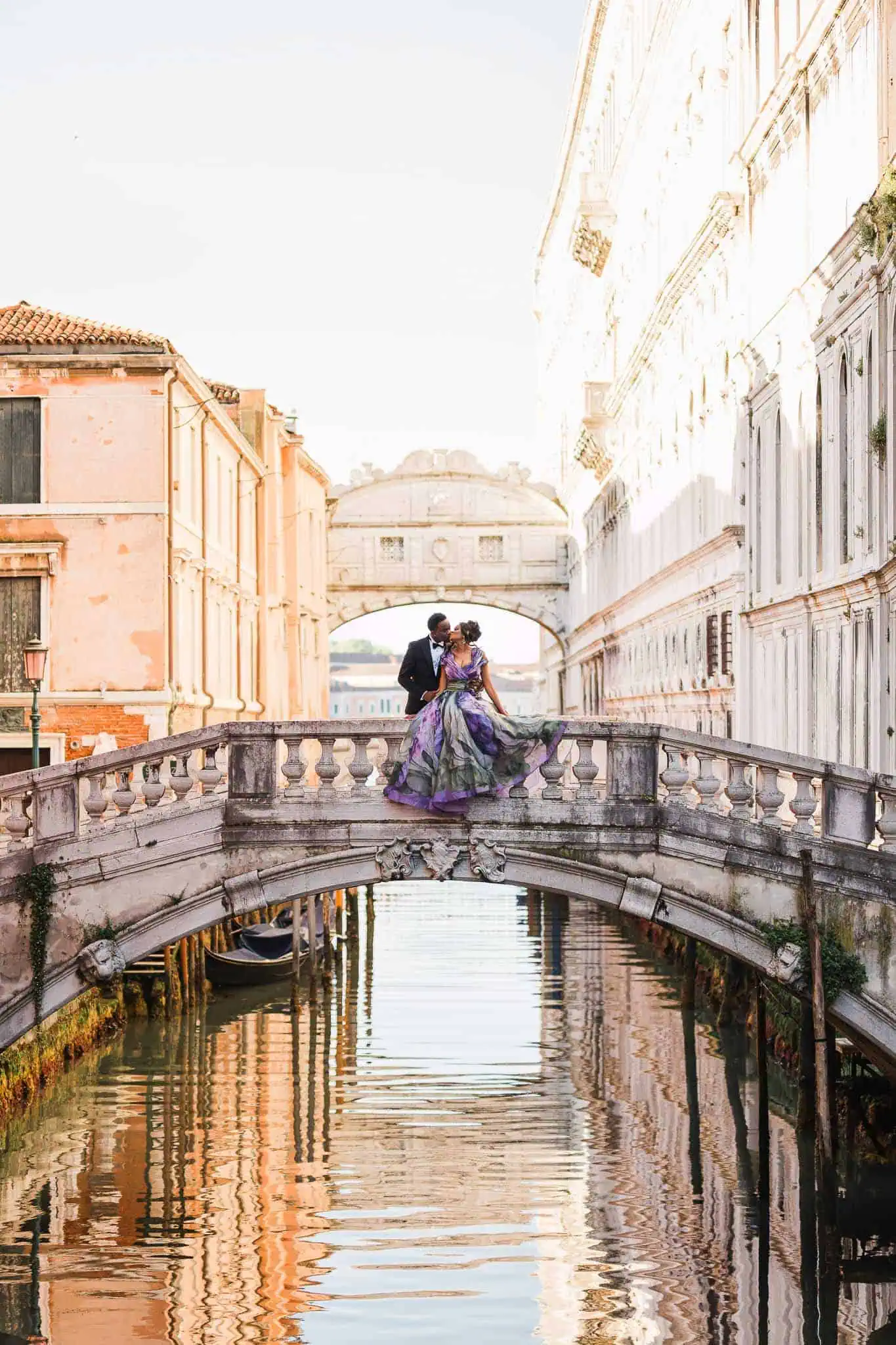 Elegant couple on a bridge in Venice, stunning wedding, proposal, engagement photography, romantic cityscape, Lore Venice.