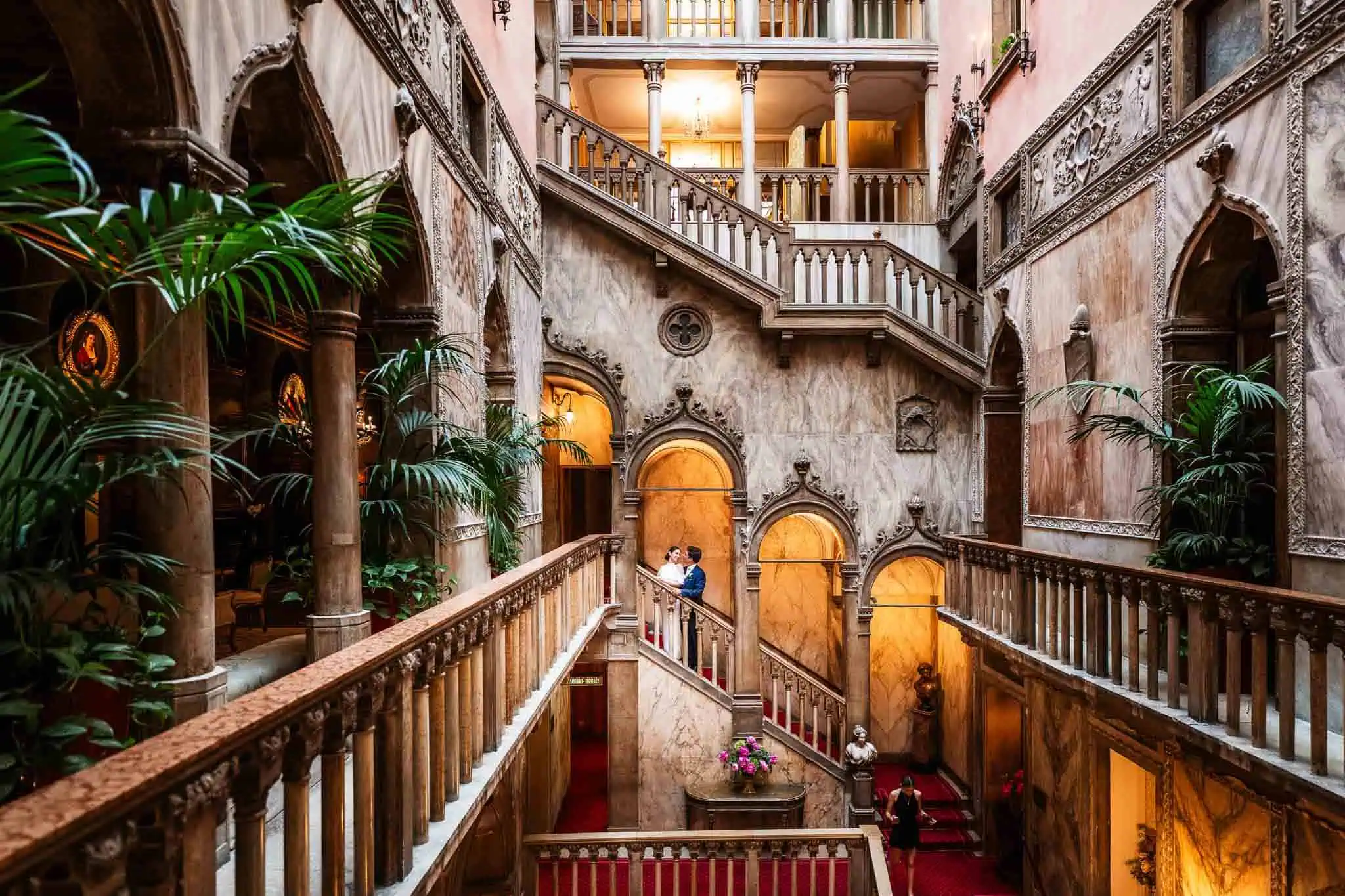 Elegant Venetian interior with marble walls and intricate architectural details.