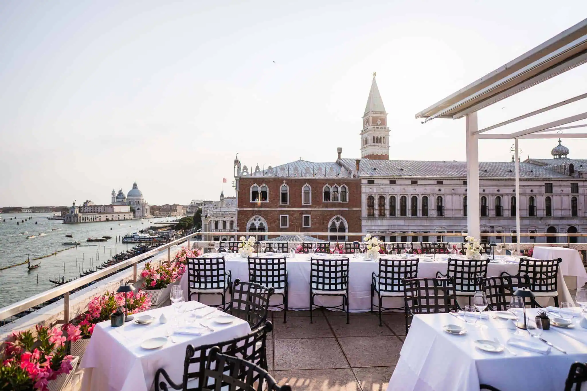 Elegant rooftop dining overlooking Venice canals and historic architecture, perfect for weddings and celebrations.