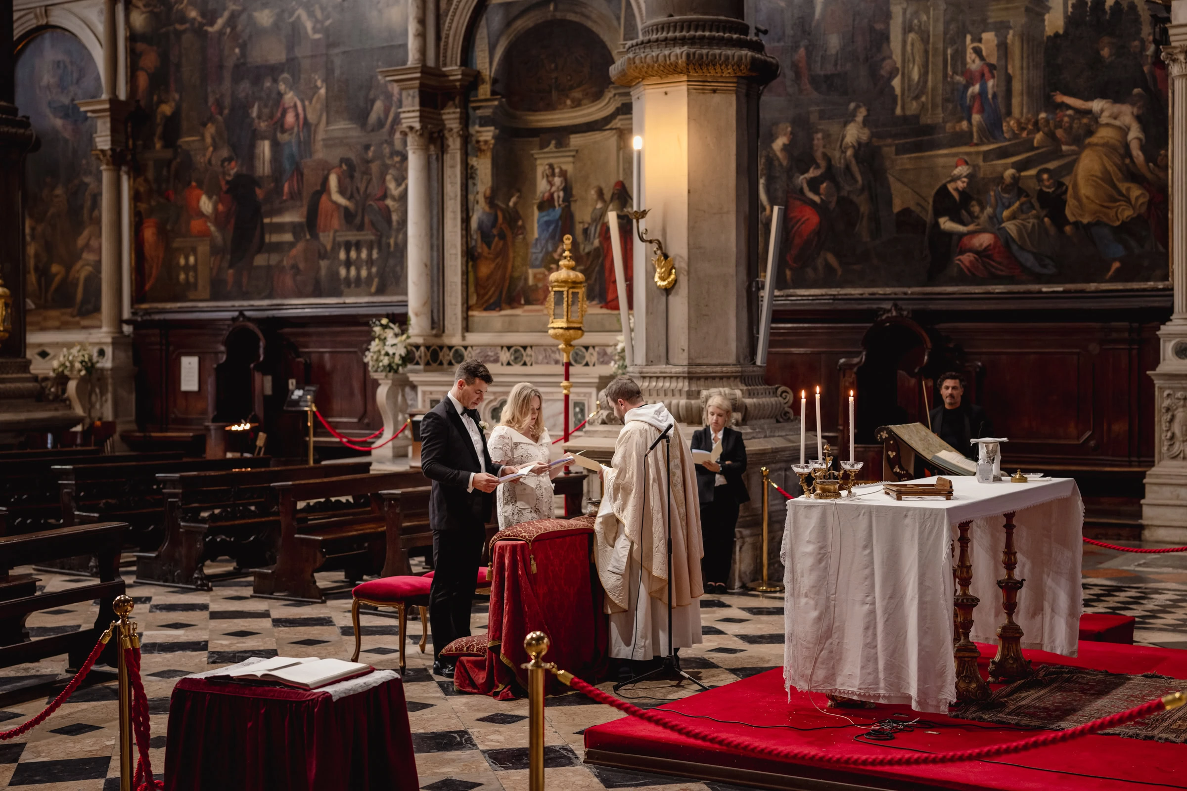 Elegant couple exchanging vows in a historic church during an elopement ceremony.