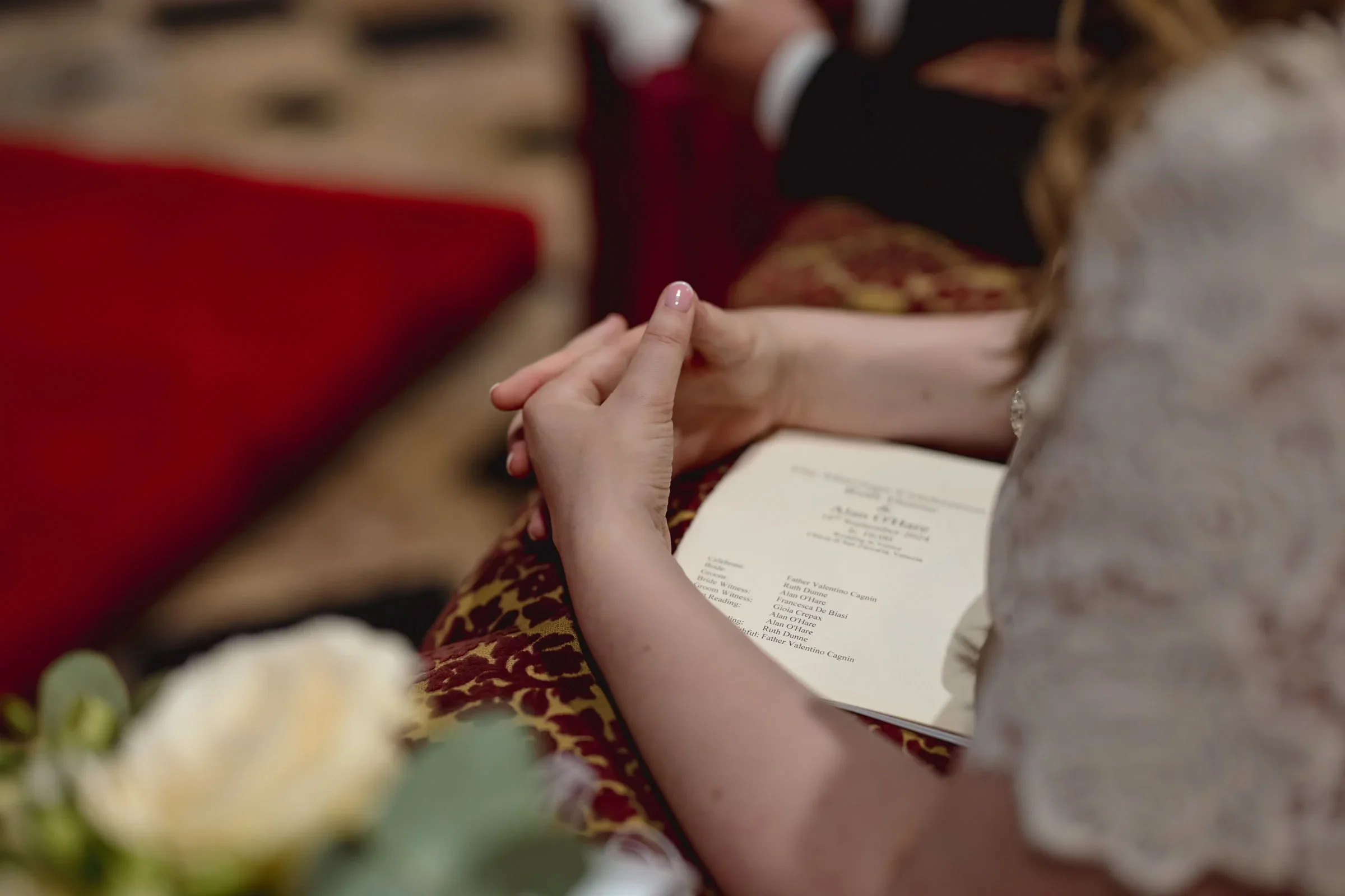 Intertwined hands holding during an intimate elopement ceremony.