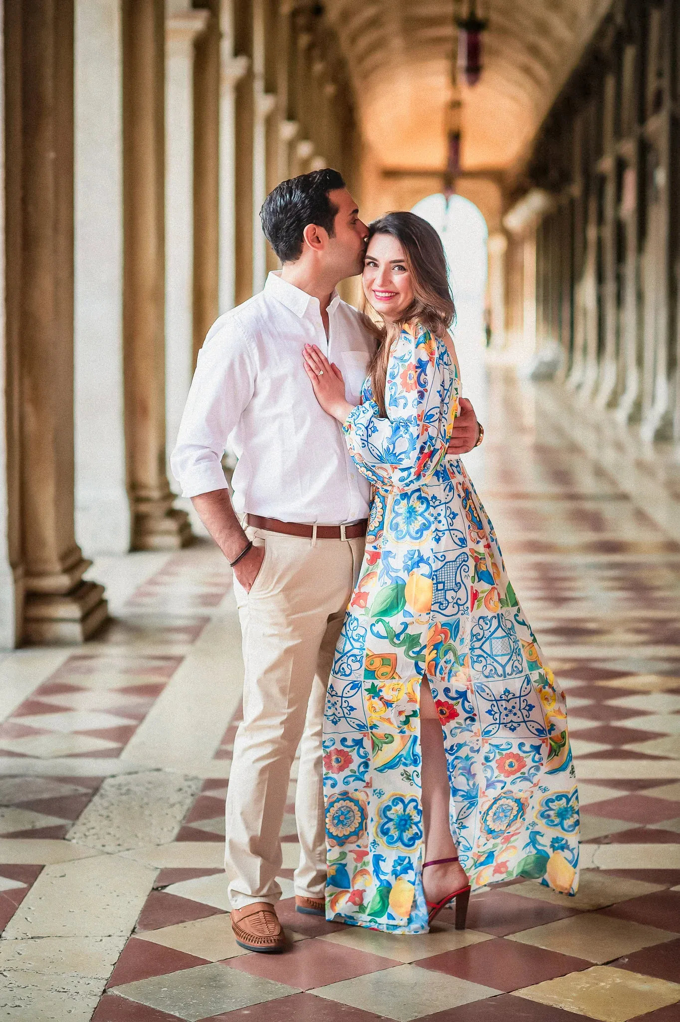Vintage couple in Venice, engaged at historic location, romantic proposal, travel wedding photography, colorful attire, love story.