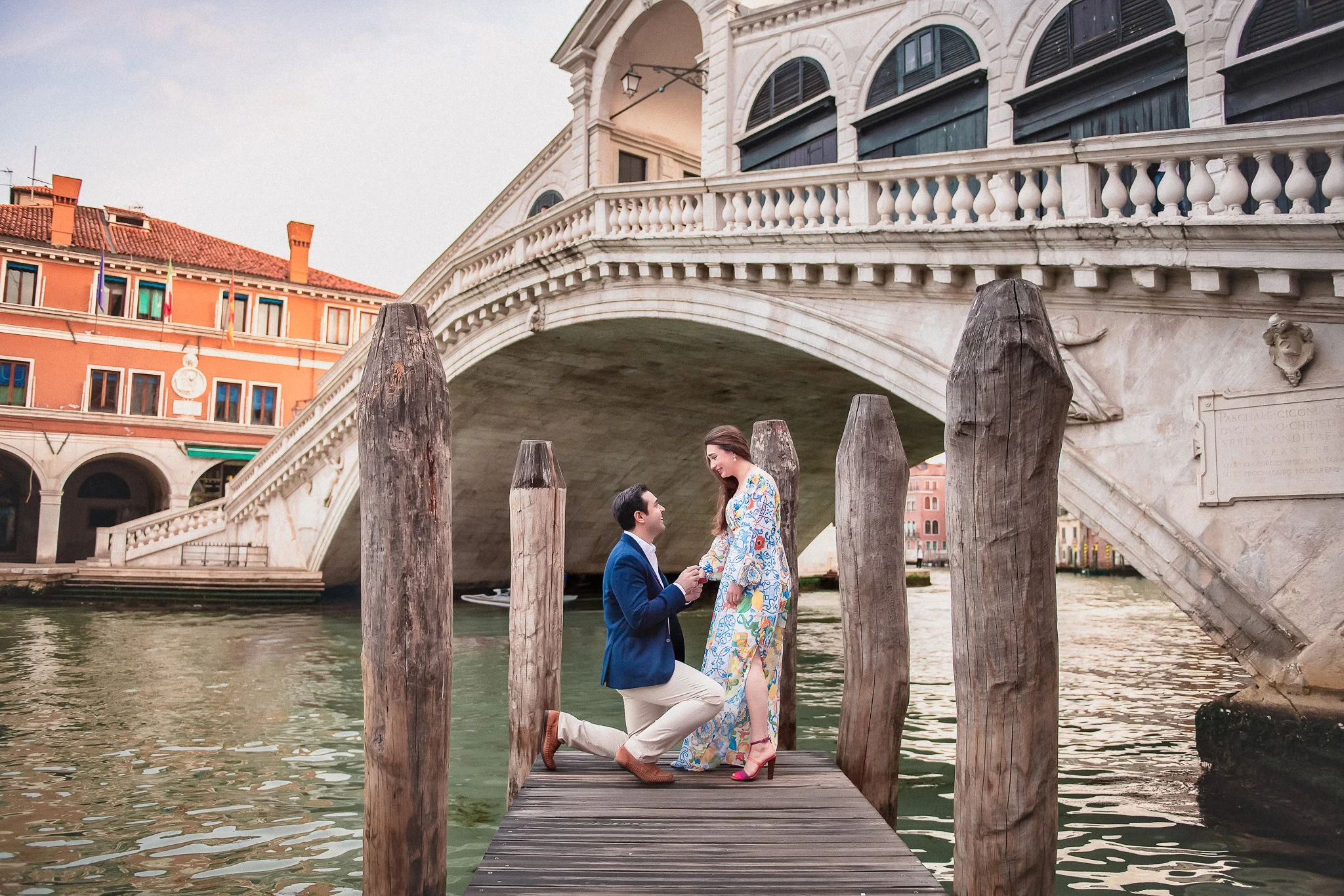 Romantic Venice proposal underneath the iconic Bridge of Sighs, capturing love and breathtaking scenery.