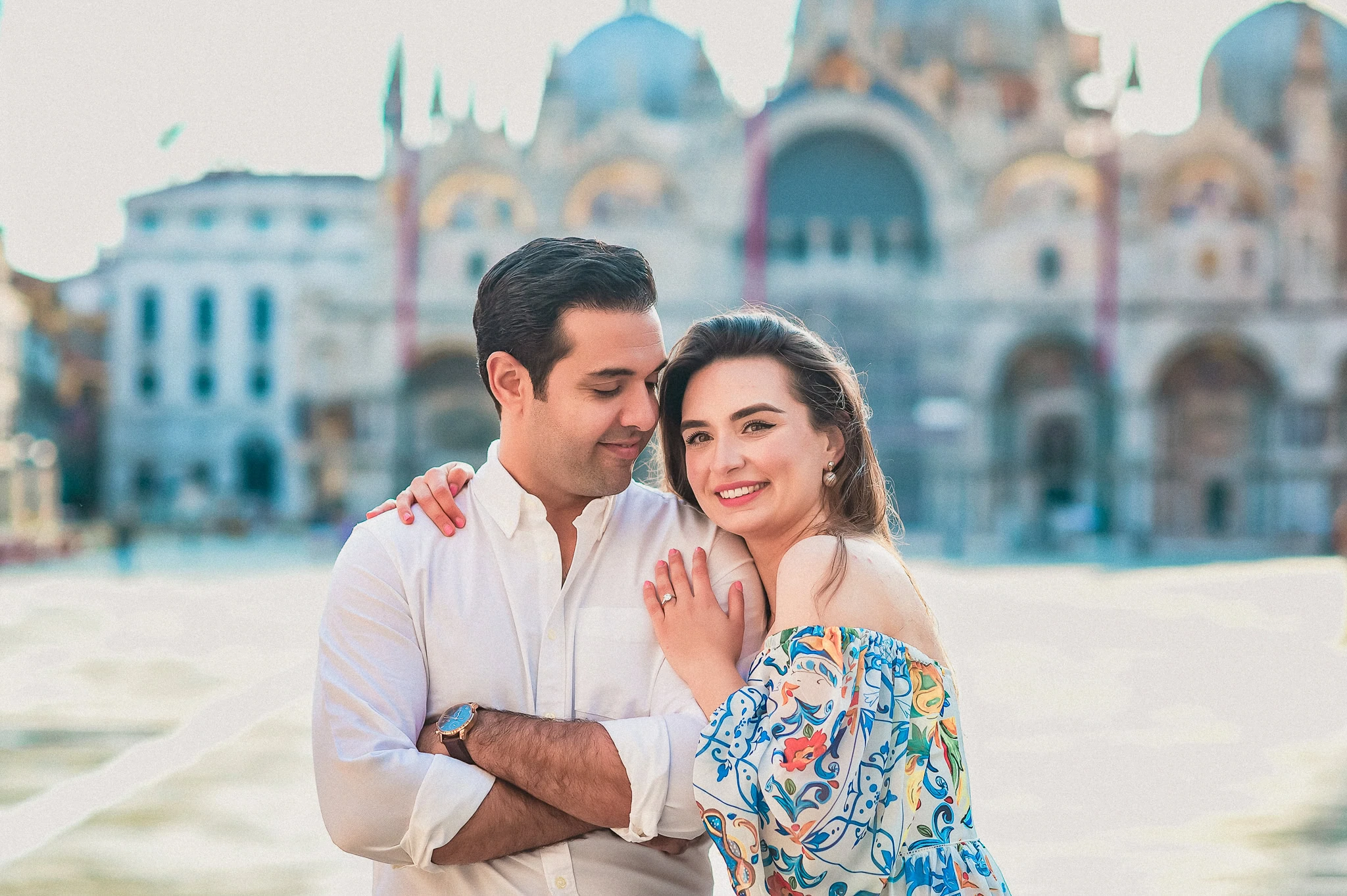 Romantic couple in Venice, enjoying engagement photoshoot with iconic background.