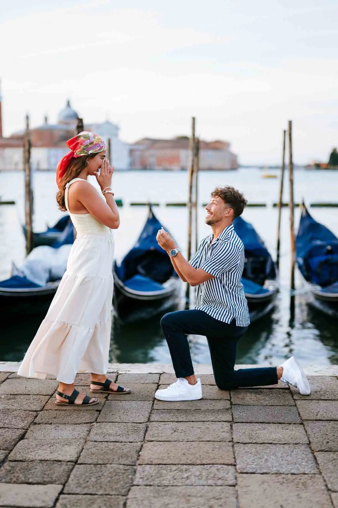 Romantic proposal in Venice, gondolas, love, couple, Italian scenery, outdoor, tourism, engagement, travel, Italy, historic city, waterfront.
