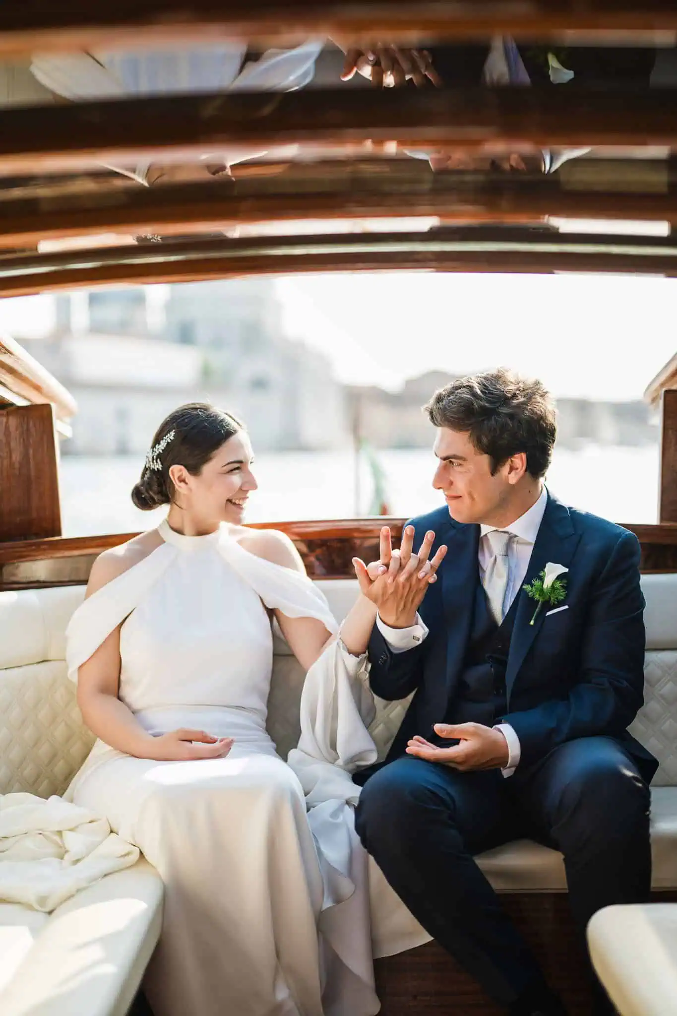 1. Romantic Venice wedding couple inside a classic wooden boat.