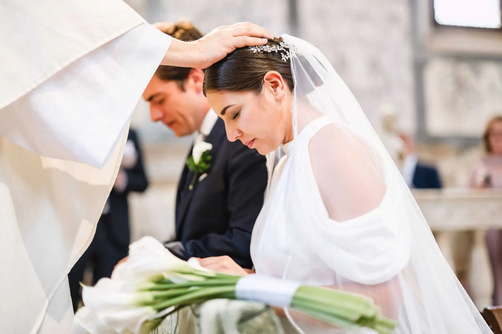Elegant bride and groom during a wedding ceremony at Venice church, captured by Venice wedding photographer.