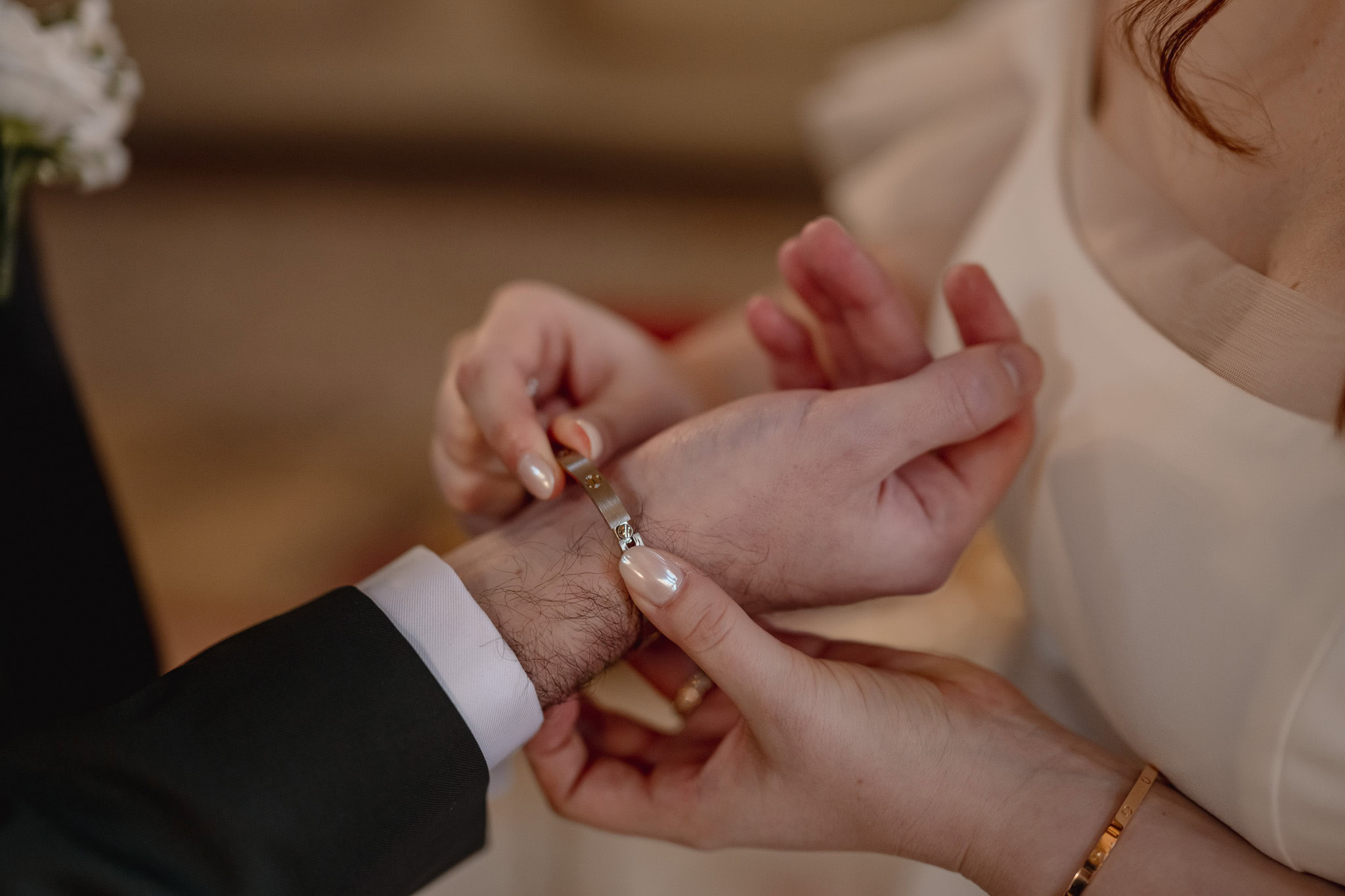 Couple exchanging rings at Ca’ Sagredo Palace in Venice during an elopement moment.