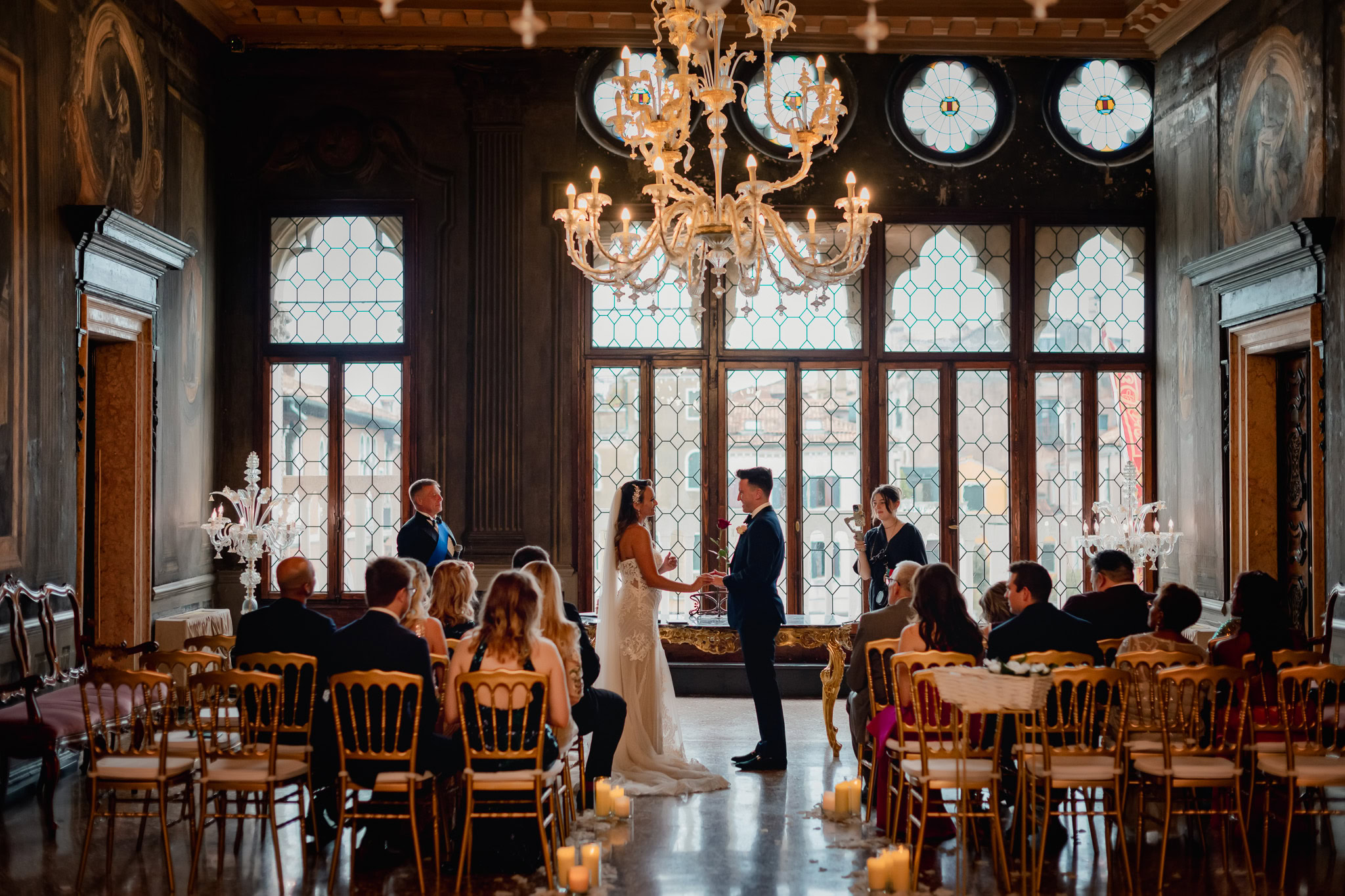 Wedding couple exchanging vows inside Ca' Sagredo palace in Venice.