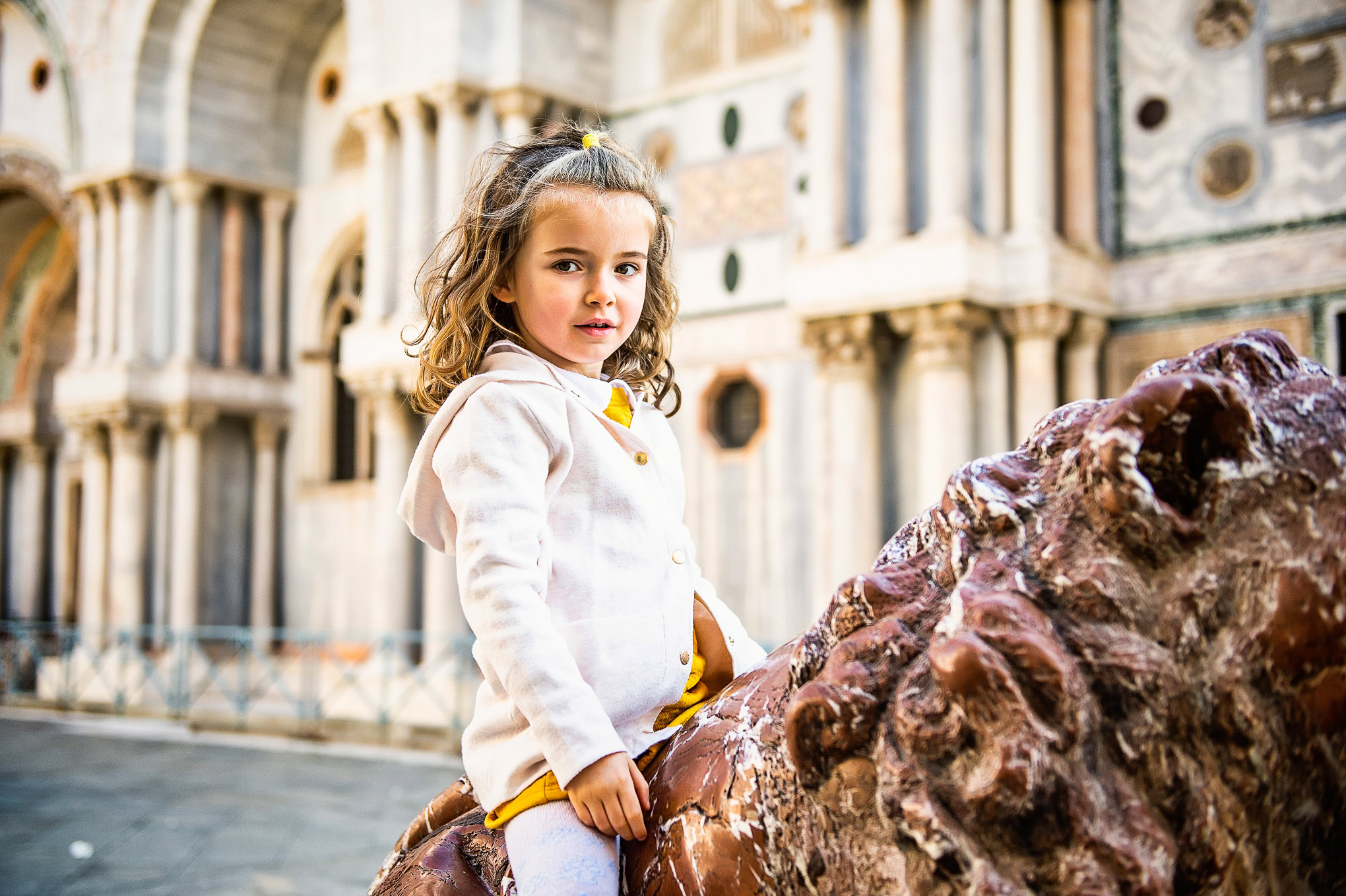Family enjoying a sunny day near Venice's historic architecture, capturing candid moments of connection and exploration.