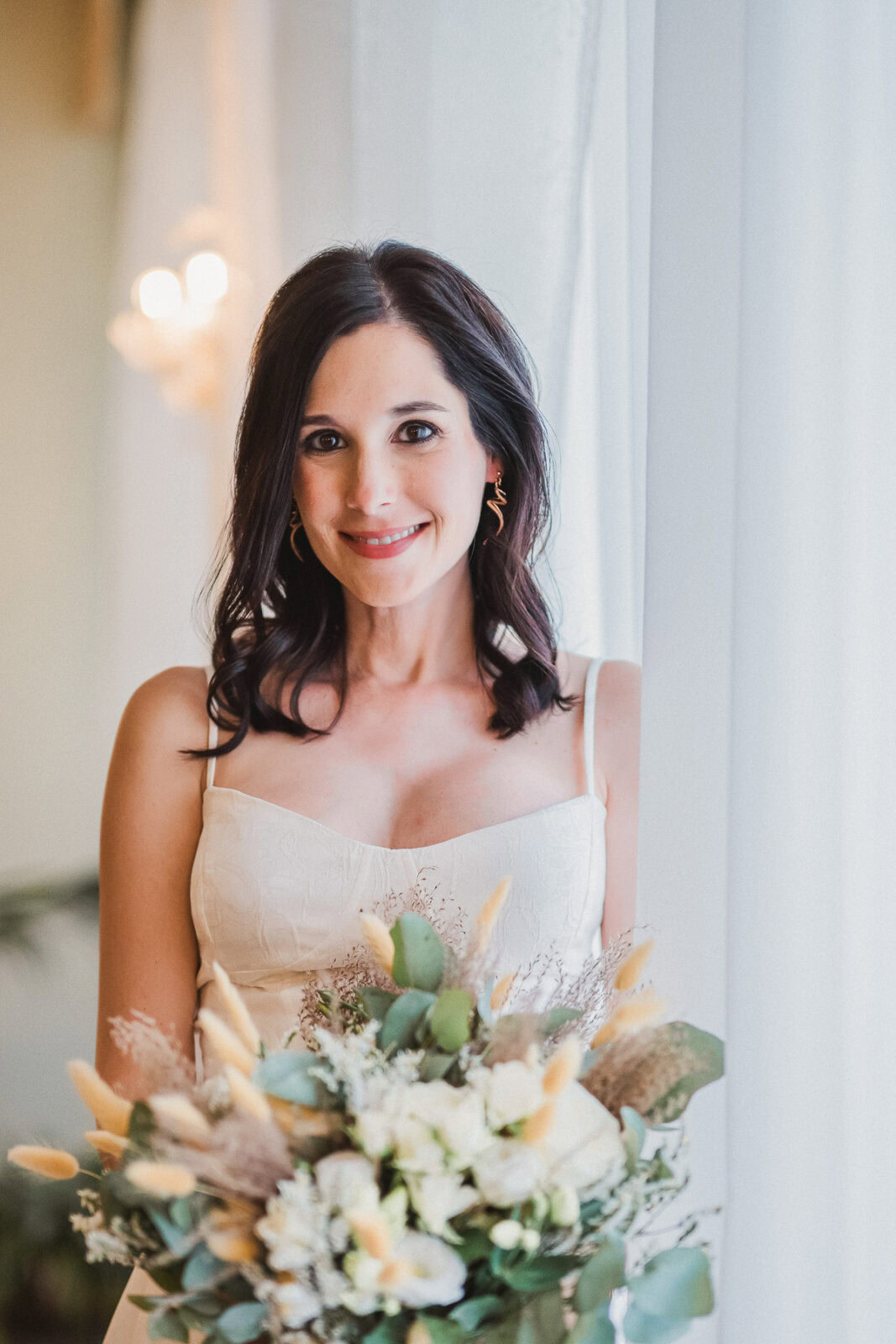 Elegant bride at Palazzo Cavalli wedding with Venice Grand Canal view and natural light.