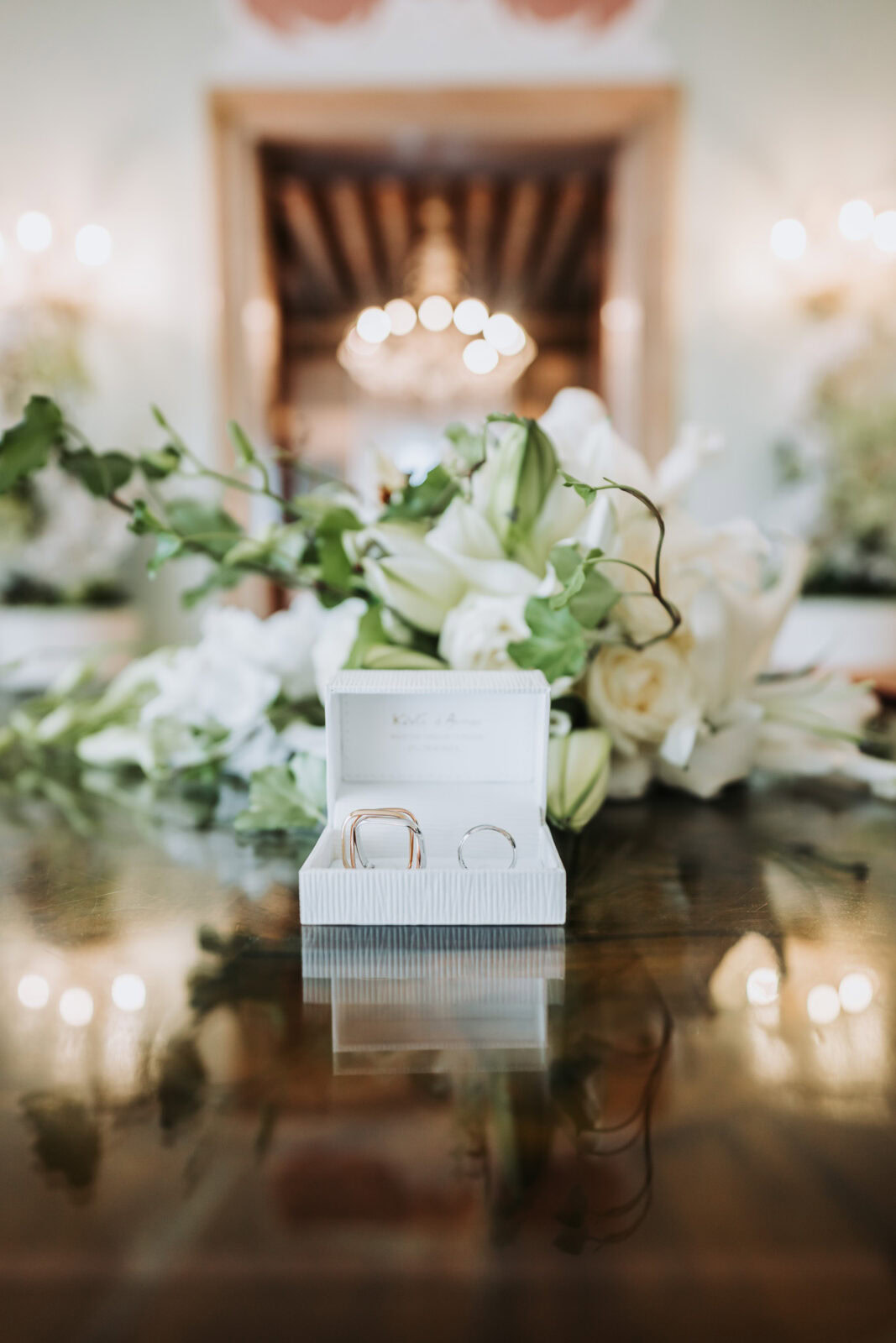 Wedding rings displayed at Palazzo Cavalli with Venice Grand Canal view and elegant architecture.