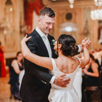Couple dancing Baglioni Hotel Luna Venice ballroom wedding reception chandelier warm light