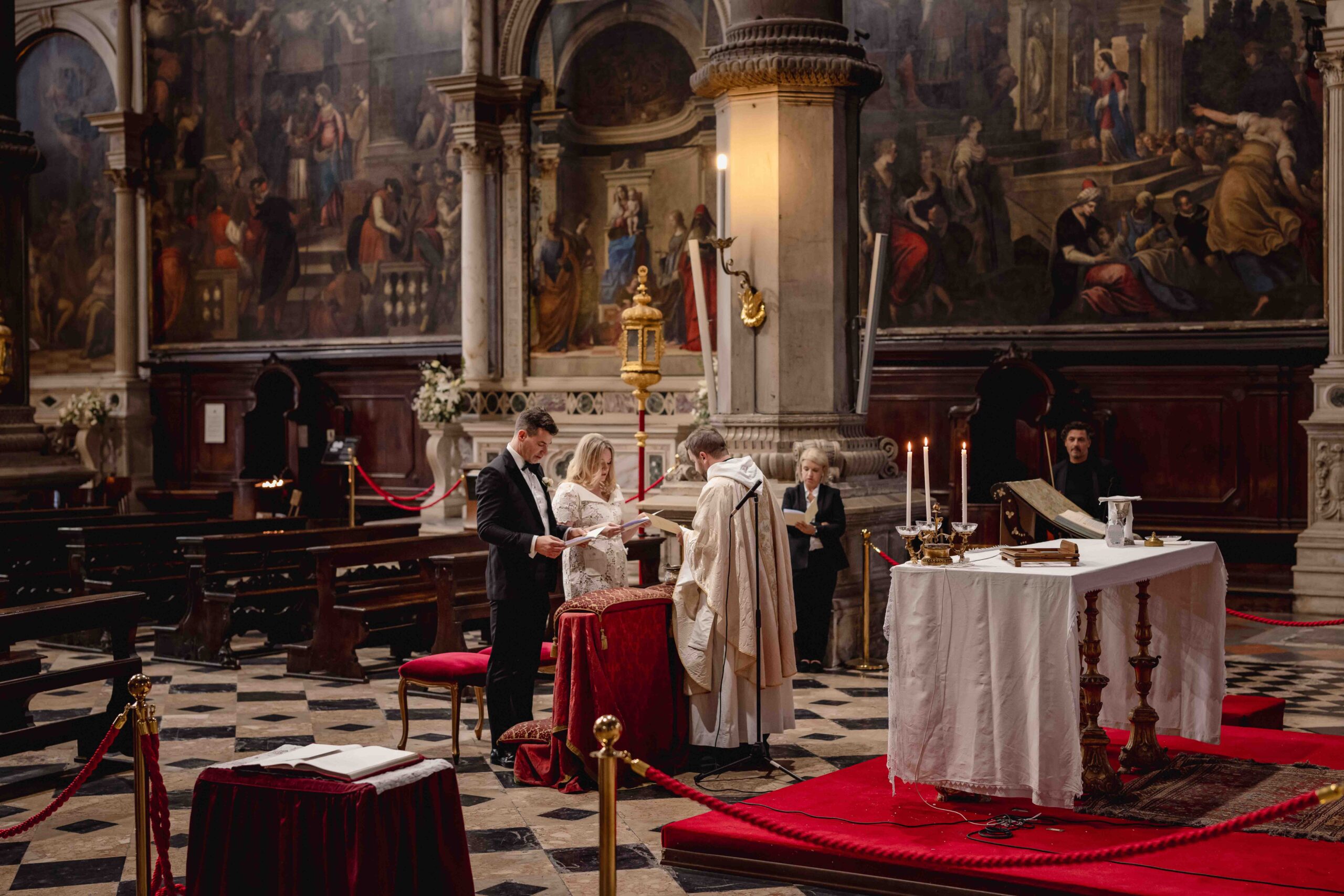 Venetian Church elopement ceremony with couple and priest inside a historic Venetian church.