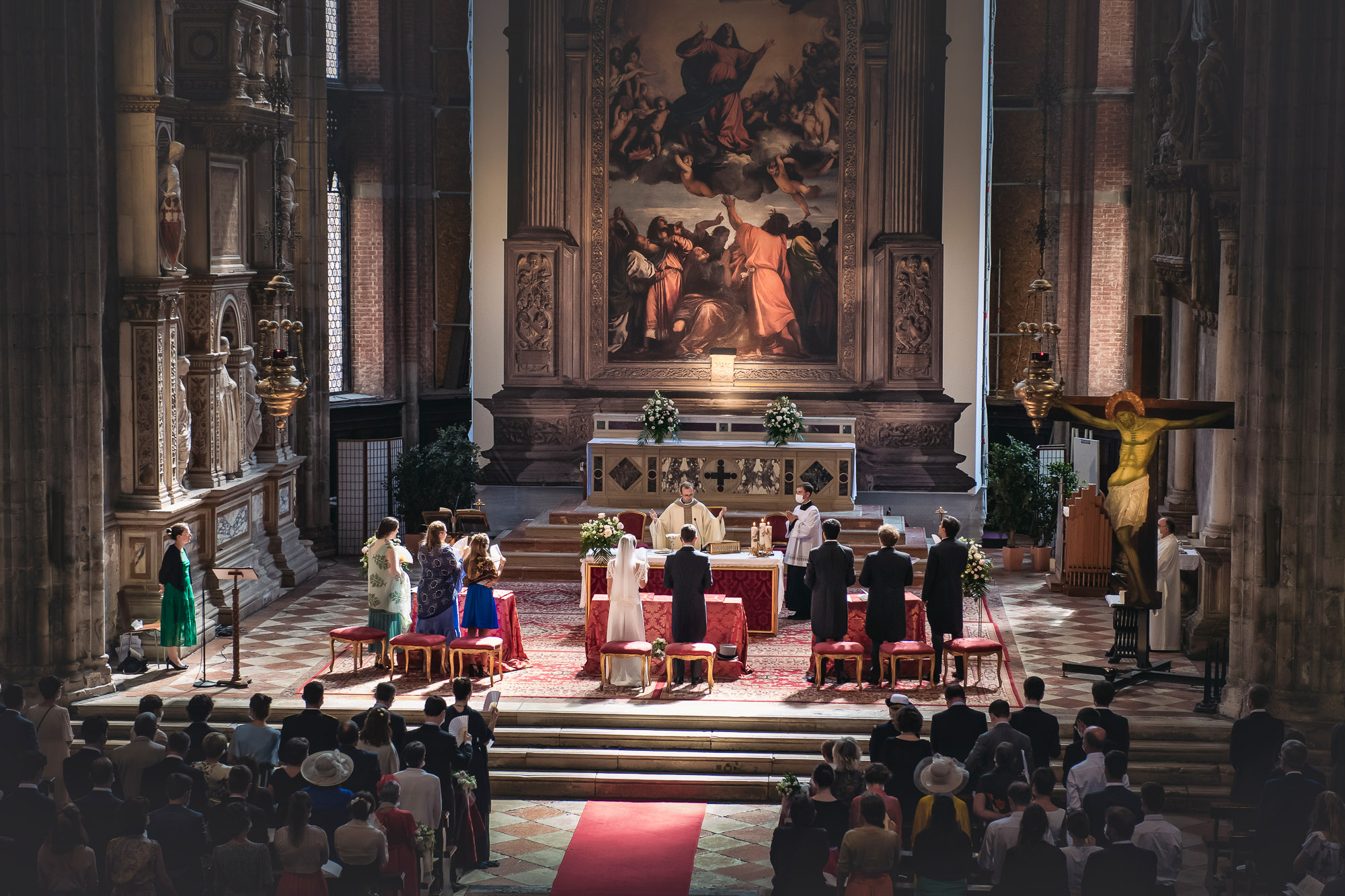 Venice church, Catholic wedding ceremony with priests and couple at the altar.
