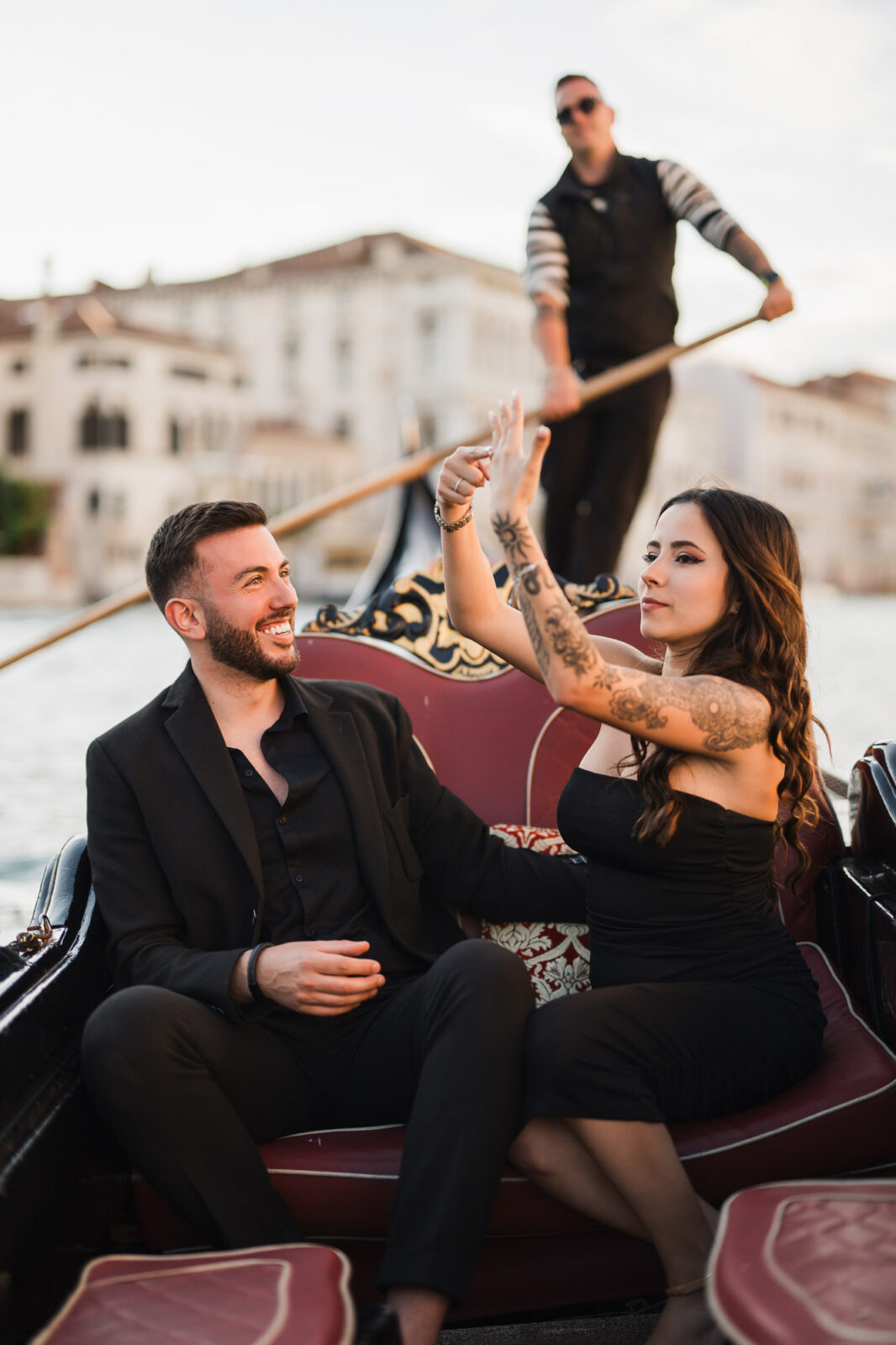 Romantic gondola proposal in Venice with a couple and gondolier on the canal.