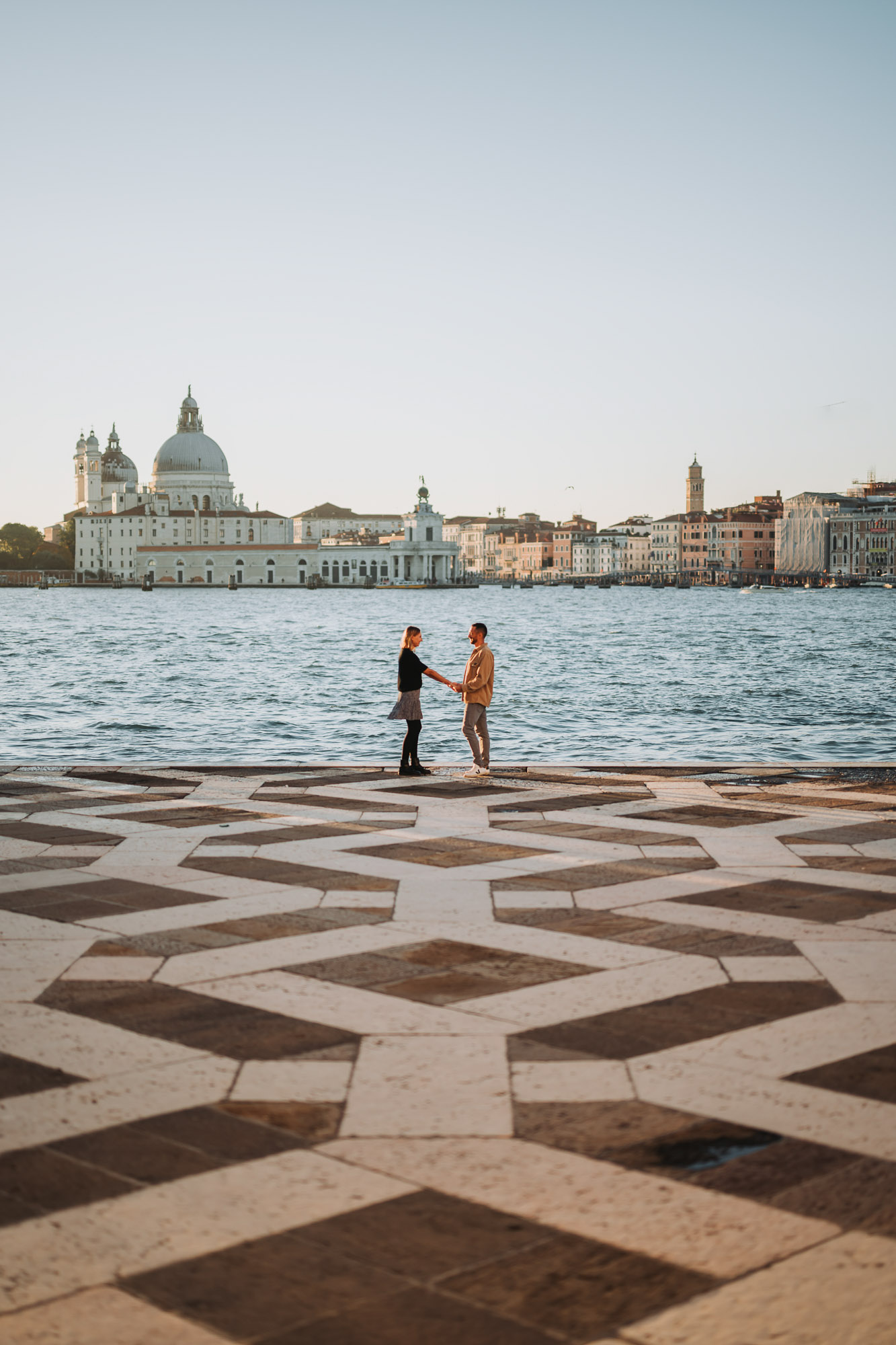 honeymoon couple portrait overlooking lagoon with San Giorgio Maggiore