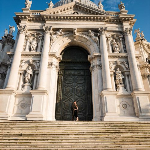 Couple on the Salute church steps after their proposal